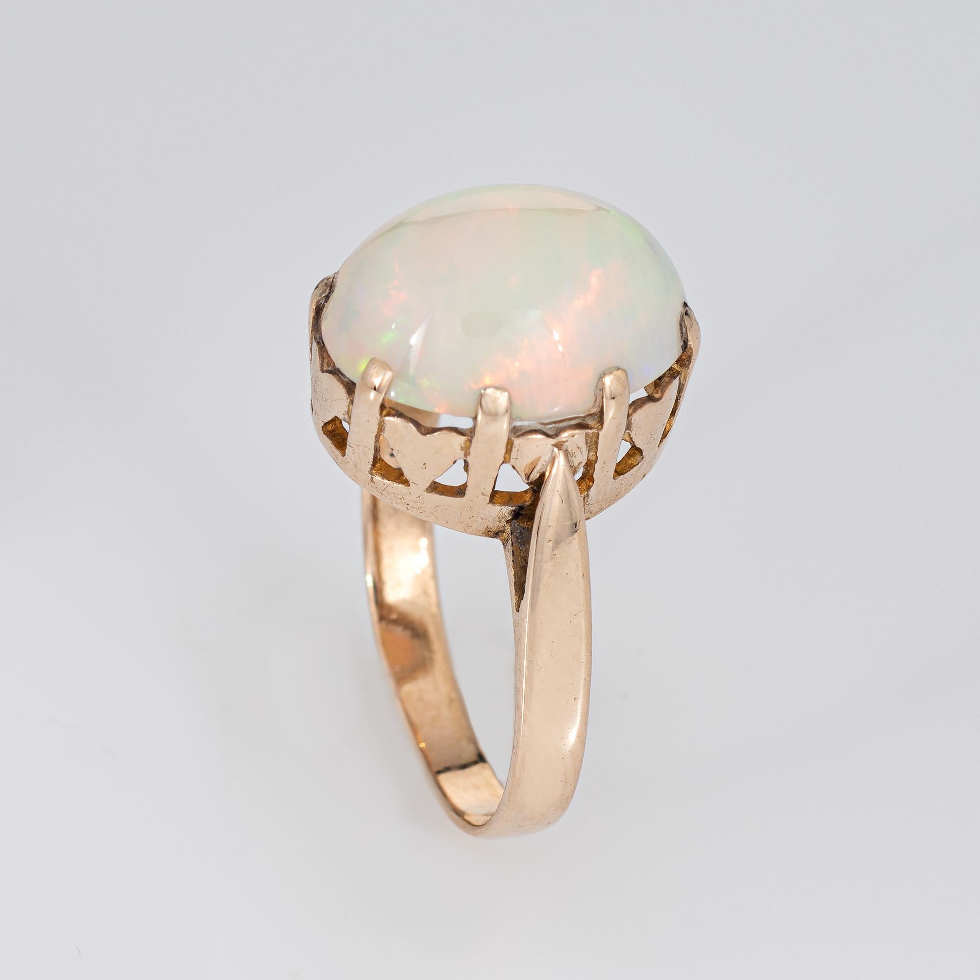 Stylish natural Ethiopian opal cocktail ring crafted in 14k yellow gold (circa 1960s)

Natural opal measures 13mm x 10mm (estimated at 5.65 carats). The opal is in very good condition and free of cracks or chips. The opal is a later addition to the