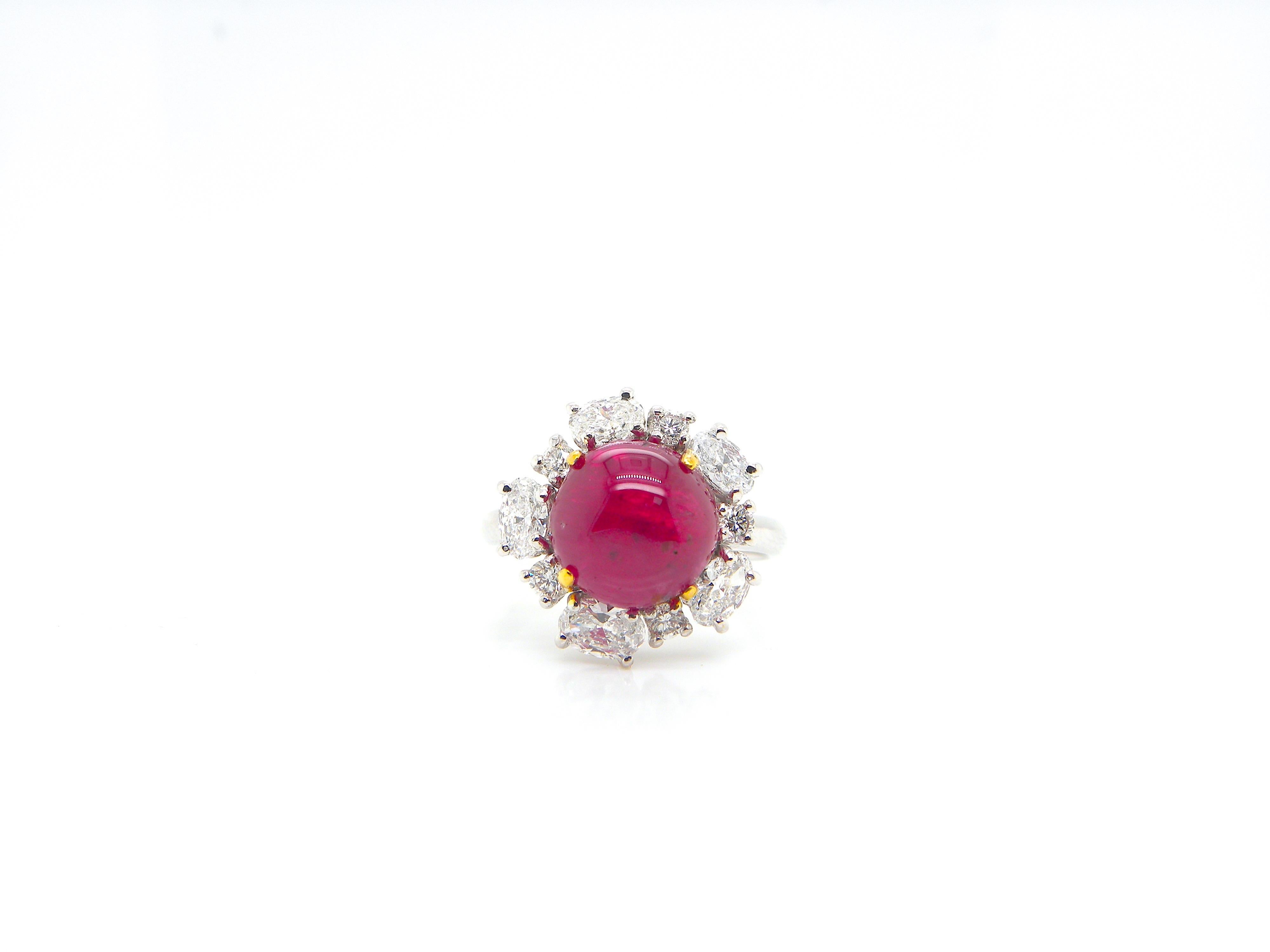 5.66 Carat GIA Certified Burma No Heat Vivid Red Ruby Cabochon and Diamond Ring:

A rare jewel, it features a 5.66 carat GIA certified Burmese unheated ruby cabochon surrounded by multitude of white oval-shaped and round-shaped diamonds weighing