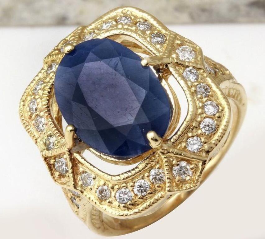 5.66 Carats Exquisite Natural Blue Sapphire and Diamond 14K Solid Yellow Gold Ring

Total Natural Blue Sapphire Weights: 4.91 Carats

Sapphire Measures: 12.73 x 9.52mm

Sapphire Treatment: Diffusion

Natural Round Diamonds Weight: .75 Carats (color