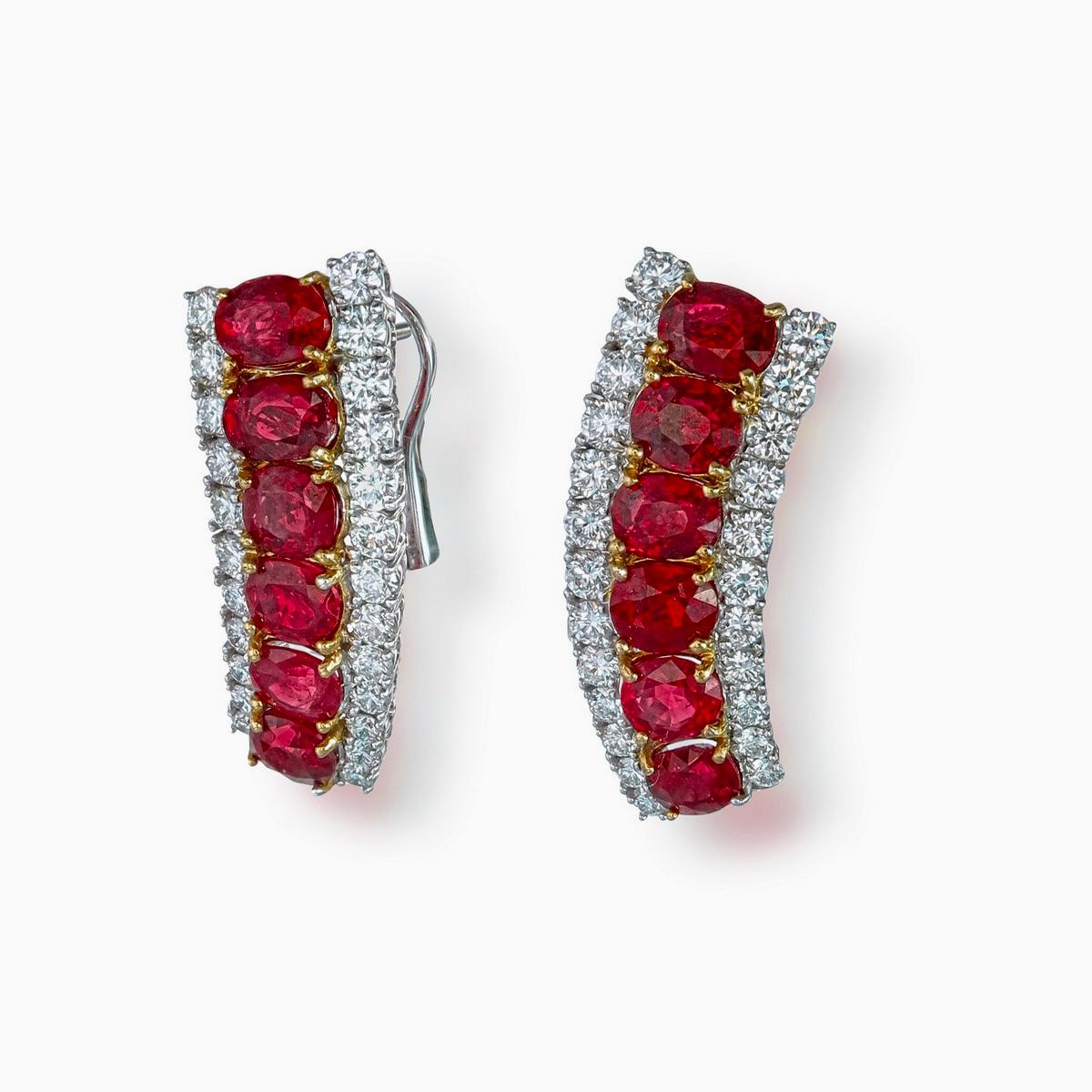 This unique pair of ruby and diamond earrings from Rewa jewels are made in 18 karat white gold.

These beautiful 12 oval shaped Burmese rubies pigeon blood in colour weigh approximately total of 5.67 carats. Untreated Burmese rubies of this quality