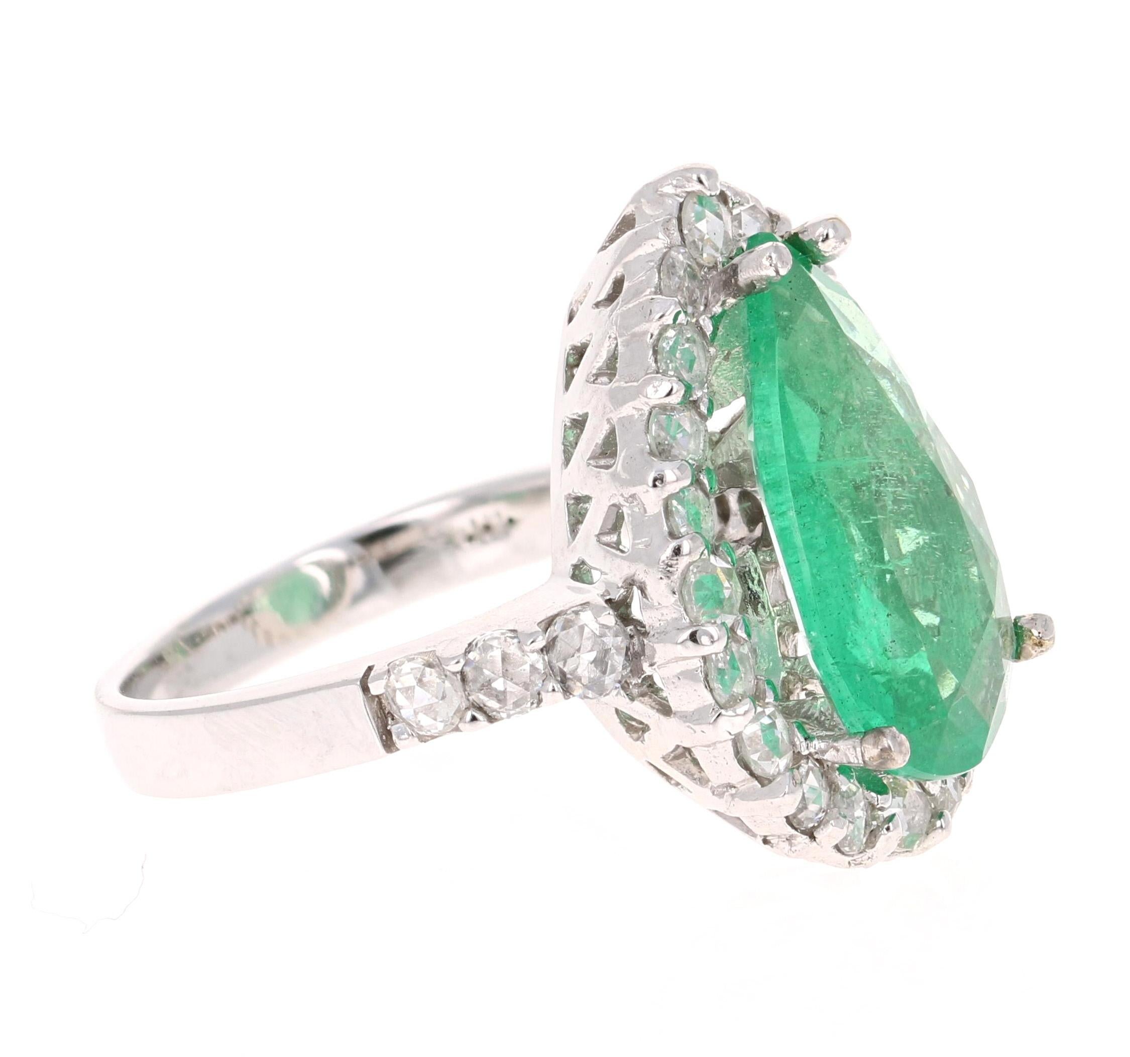 This is a gorgeous, gorgeous, gorgeous Emerald and Diamond Ring! This 14K White Gold Ring has a stunning  Pear Cut Emerald that weighs 4.51 carats. It has 28 Rose Cut Diamonds that weigh 1.16 carats. The total carat weight of this ring is 5.67
