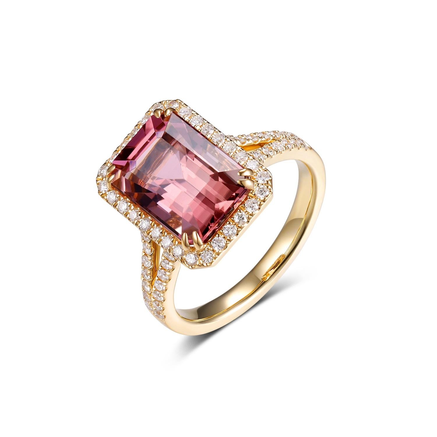 This elegant ring features a stunning 5.67-carat emerald-cut tourmaline as its centerpiece, exuding a rich and captivating hue. The tourmaline is beautifully framed by a halo of sparkling diamonds, totaling 0.43 carats, which enhance its brilliance