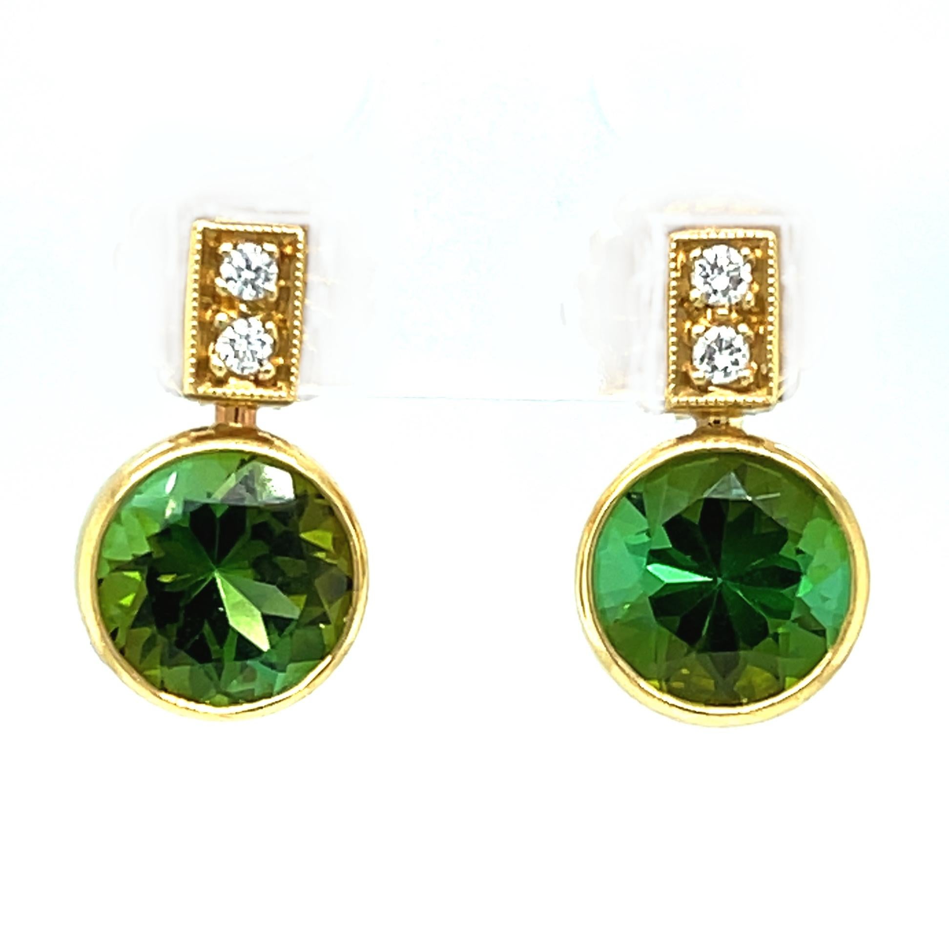 Simple and elegant, these green tourmaline and diamond earrings are so flattering, neutral, and versatile! They feature two sparkling round tourmalines with gorgeous, vibrant pine green color. Brilliant cut diamonds set in 18k yellow gold add