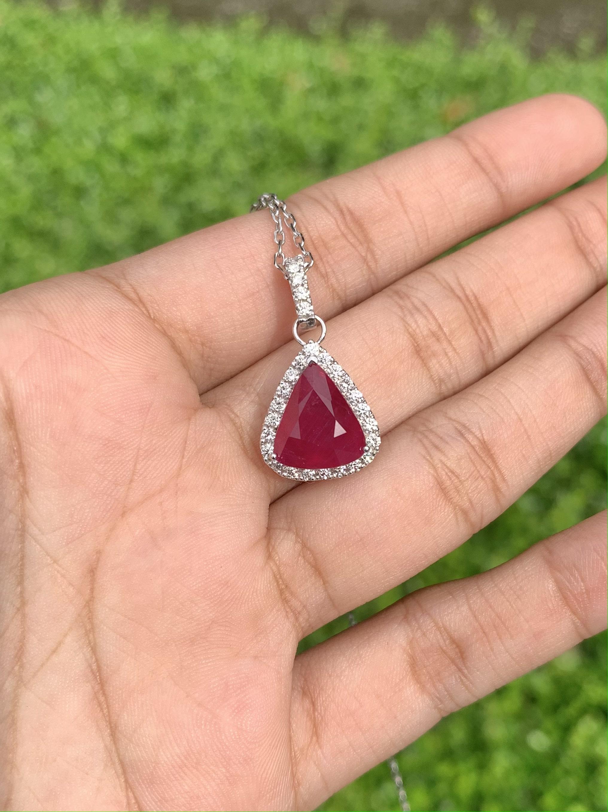 Showcasing a lovely and delicate Ruby Pendant, that boasts an enchanting pigeon blood hue that will instantly steal your heart. Prepare to be enthralled by the sheer magnificence of this 5.68 Carat Ruby, that has a pear-shape and is sourced from the