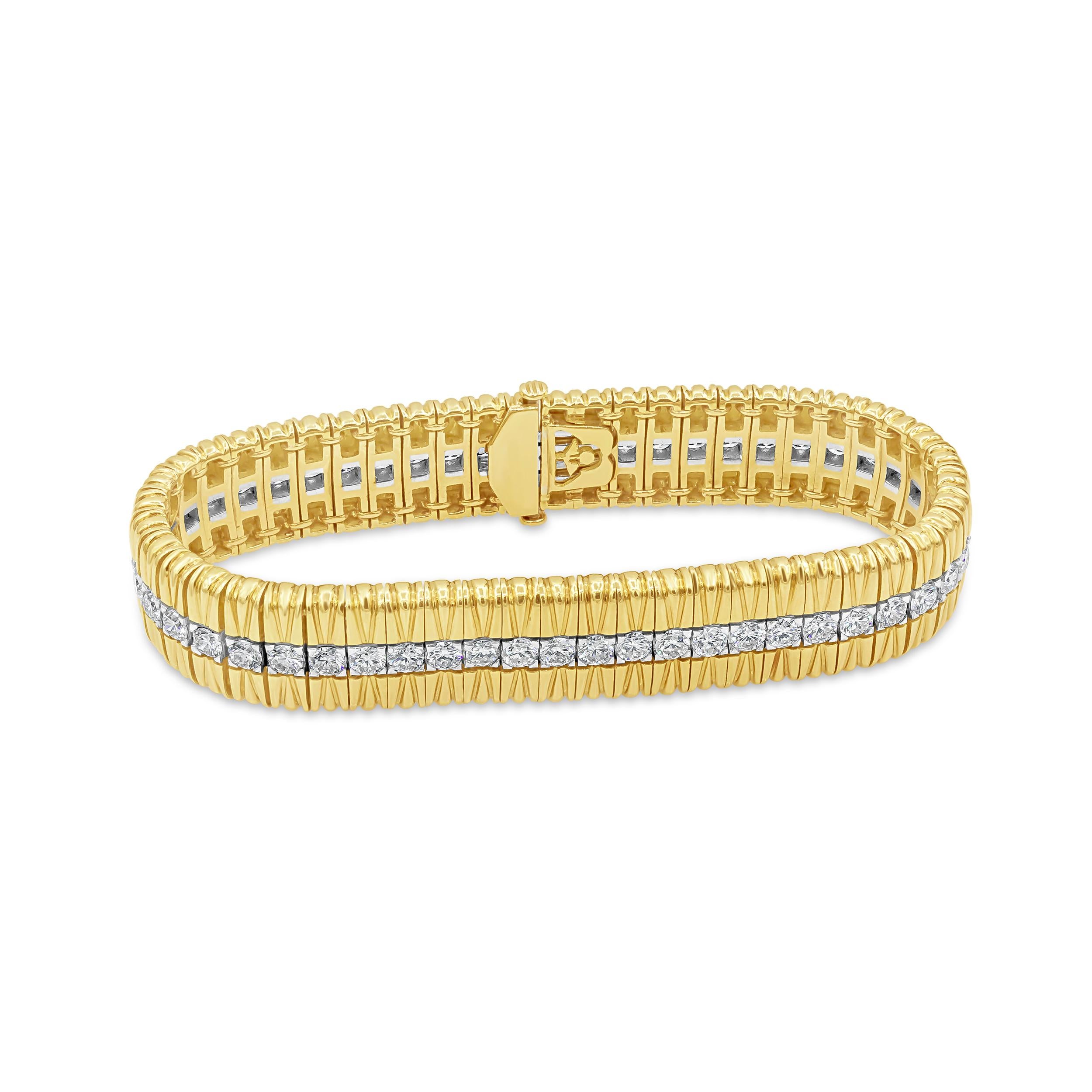 Showcasing a line of round brilliant diamonds weighing 5.68 carats total, each diamond set in a flushed basket setting made in platinum. The line of diamonds is set in-between 18K yellow gold. Diamonds are approximately F +color, VS + clarity.

