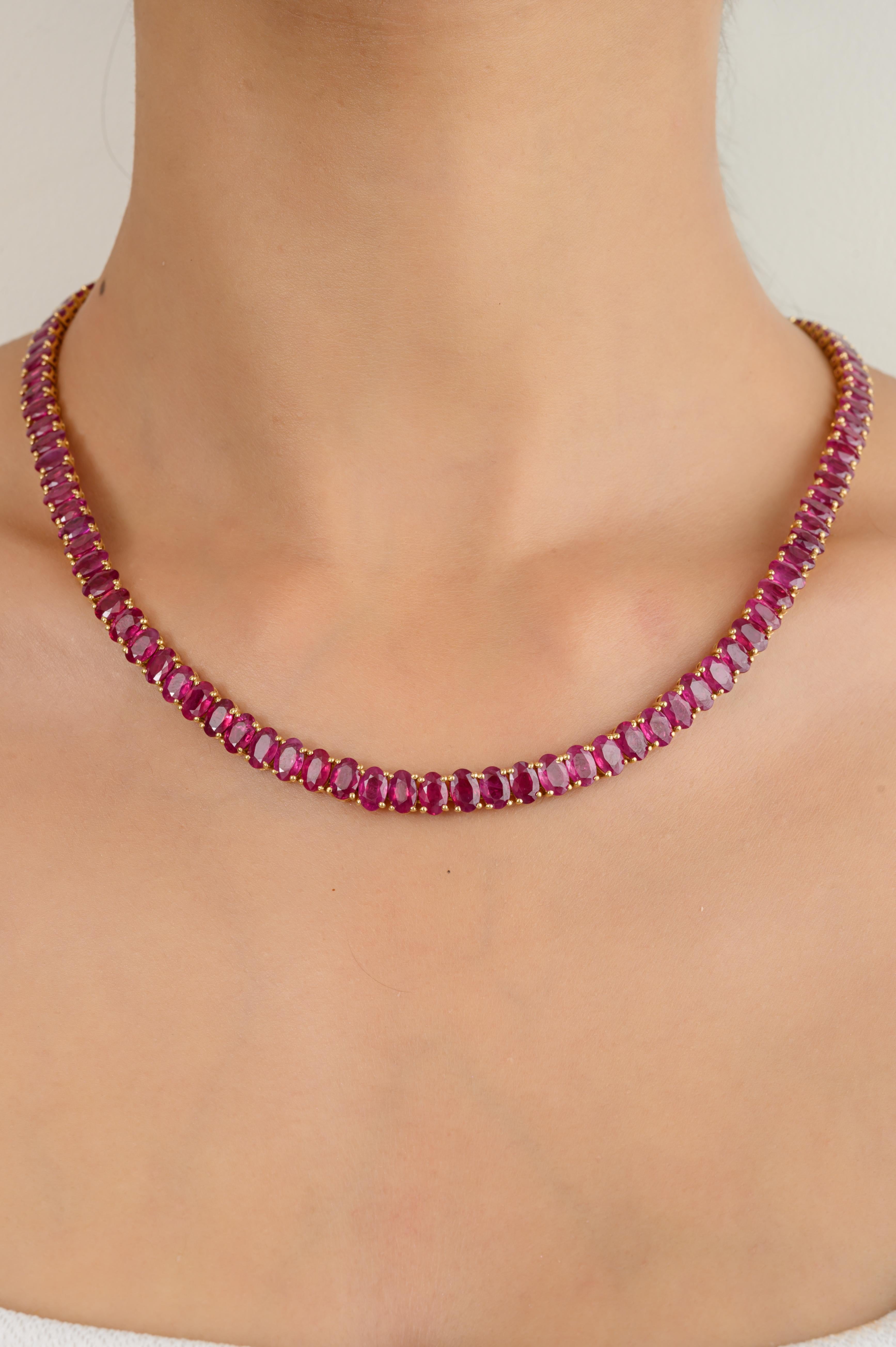 56.83 Carats Genuine Ruby Tennis Necklace for Wedding in 18K Gold studded with oval cut ruby of 56.863 carats. This stunning piece of jewelry instantly elevates a casual look or dressy outfit. 
Ruby improves mental strength.
Designed with oval cut