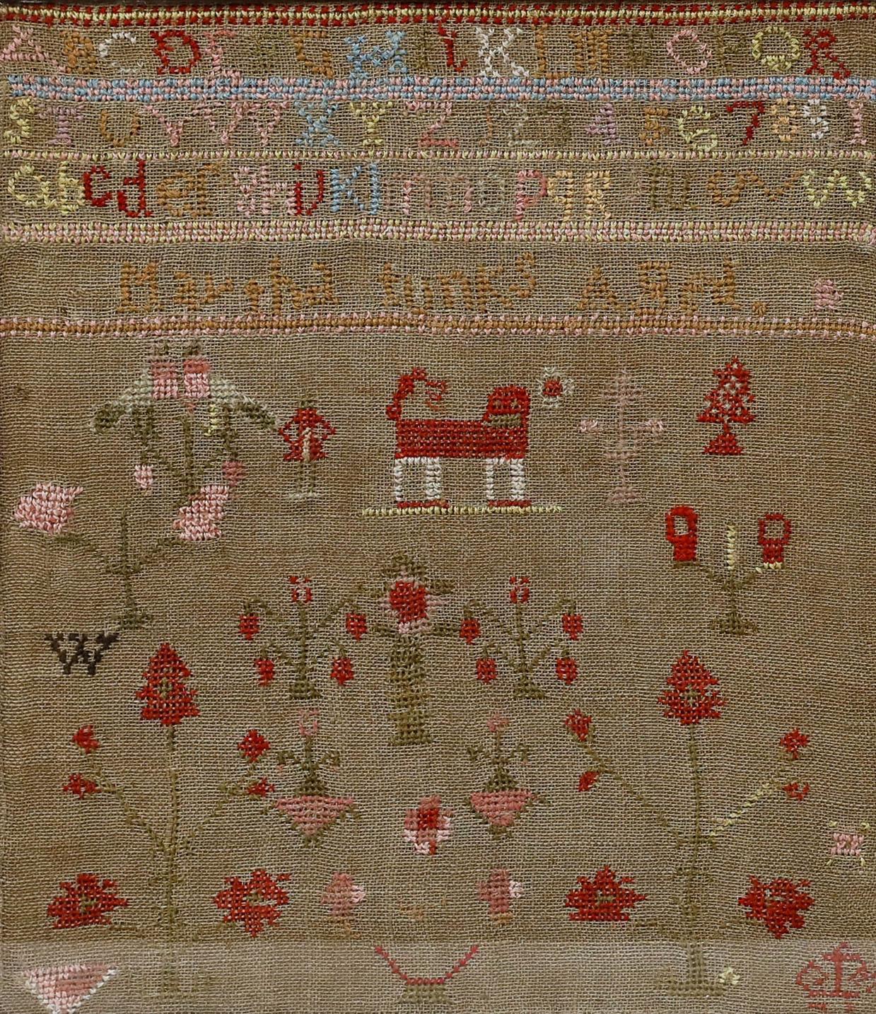 A colourful early 19th-century needlework sampler detailing cases of the alphabet, flowers and a red dog at the centre. Created by Martha, aged 10. Presented in a rustic wooden frame behind glass. Image size: 29 x 25.5cm.