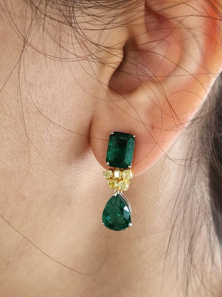 A very gorgeous and one of a kind, Emerald Drop Necklace set in 18K Gold & Diamond. The combined weight of the 16 Emeralds is 56.89 carats. The Emeralds are completely natural, without any treatment and is of Zambian origin. The weight of the Yellow