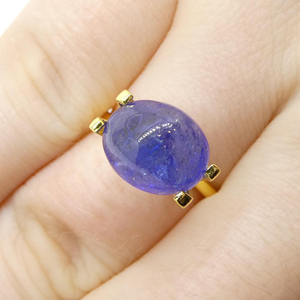 Description:

Gem Type: Tanzanite 
Number of Stones: 1
Weight: 5.68 cts
Measurements: 11.12 x 9.08 x 6.53 mm mm
Shape: Oval Sugarloaf Double Cabochon
Cutting Style Crown: 
Cutting Style Pavilion:  
Transparency: Transparent
Clarity: Moderately