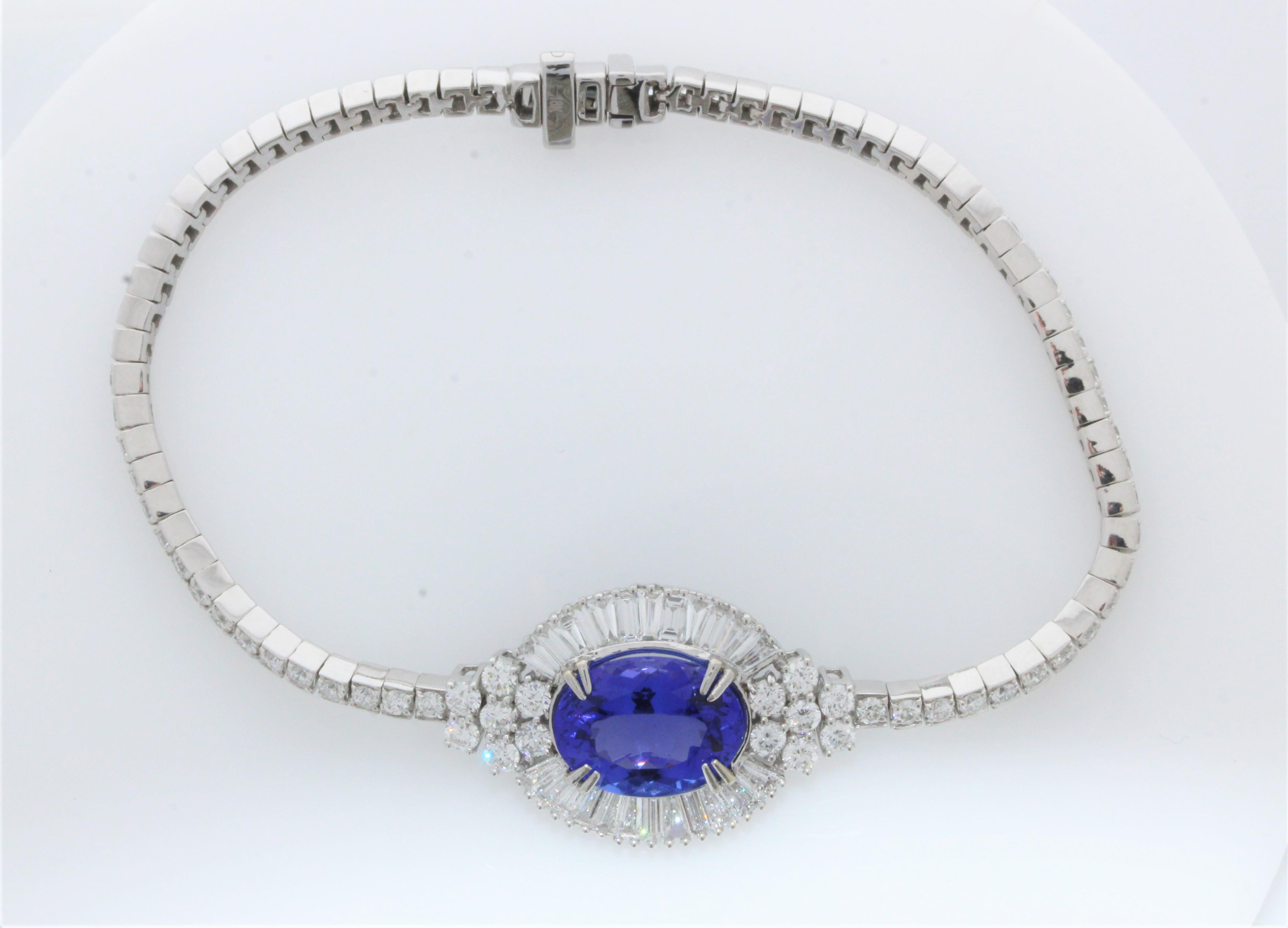 This very unique bracelets consists of a gorgeous 5.68crat tanzanite that is surrounded by glistening diamonds, and throughout, that total up 5.46carats. The bracelet is set in 18k White Gold.