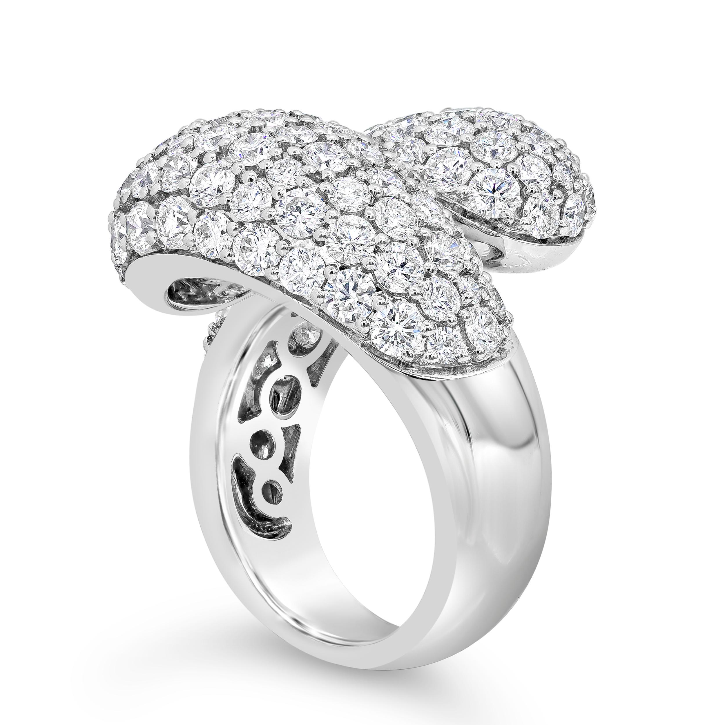 A fashionable and chic ring showcasing 118 round brilliant diamonds weighing 5.69 carats total, micro-pave set in a timeless domed bypass design. Finely made in 18k white gold. Size 7.75 US resizable upon request, 0.94 inches in width and 0.31
