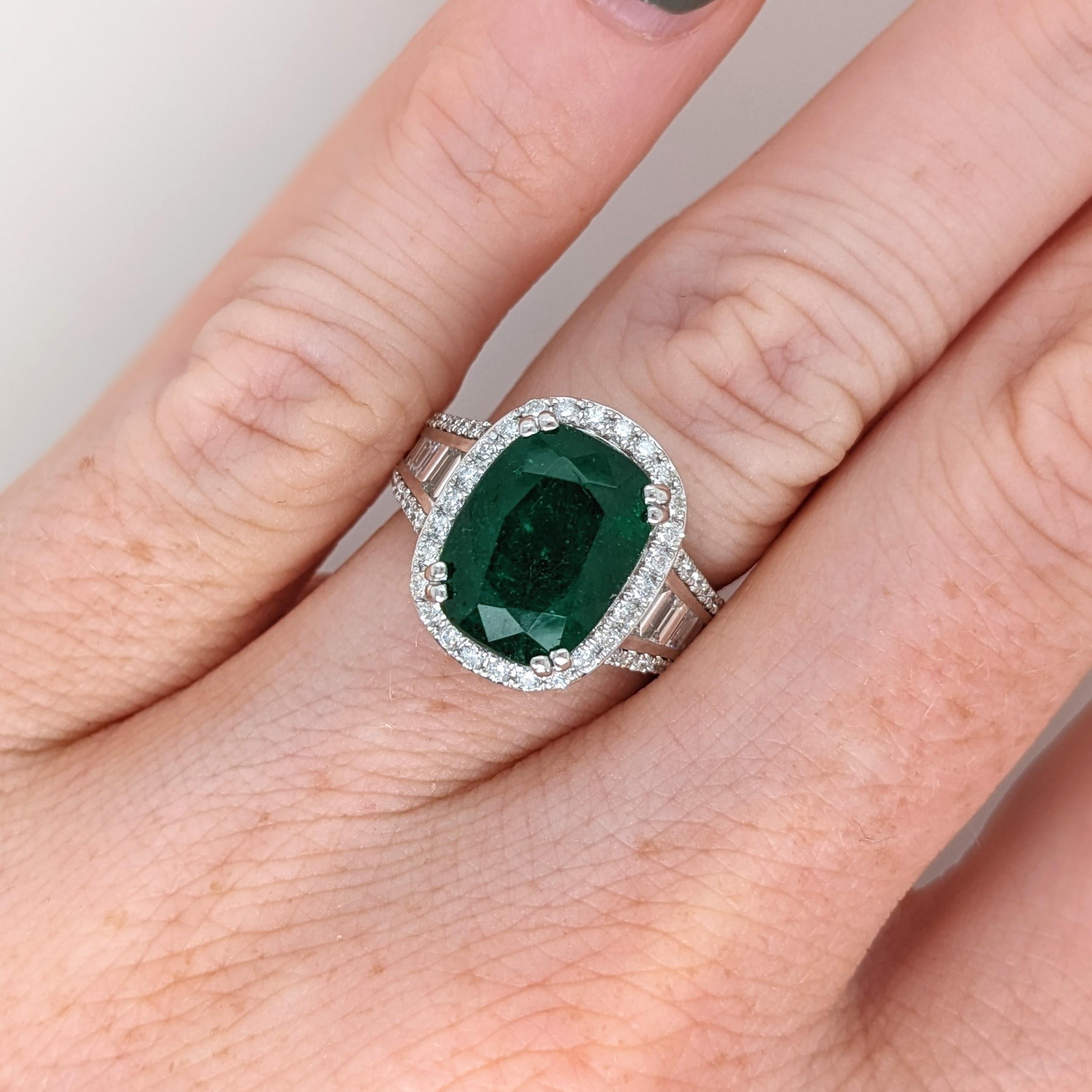 This beautiful ring features a 5.6 carat cushion cut Emerald gemstone with natural earth mined diamonds set in solid 14K gold. This ring makes a lovely May birthstone gift for your loved ones! 

Specifications

Item Type: Ring
Center