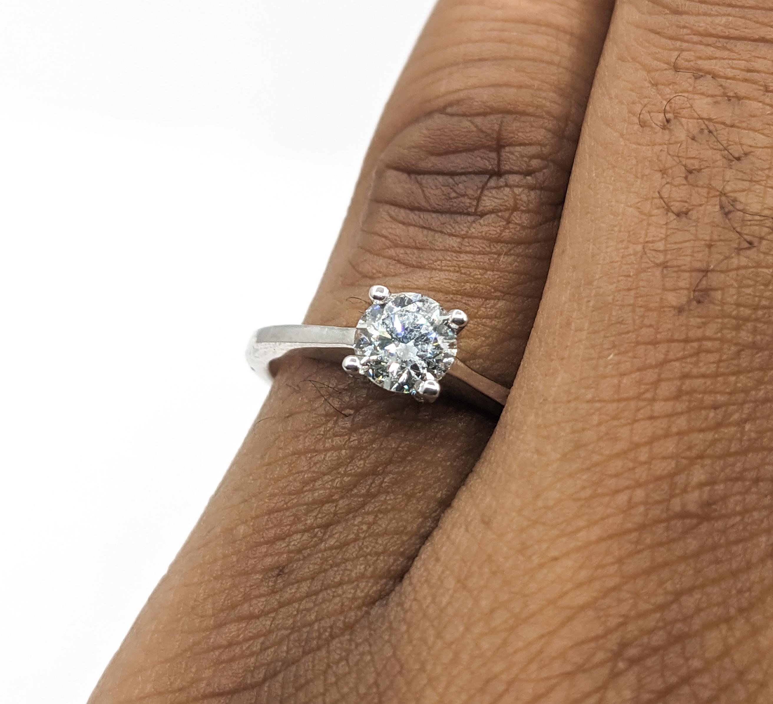 .56ctw Diamond Ring In White Gold 

Discover the timeless beauty of this Ring, expertly designed in 14kt white gold, showcasing a central .50ct round diamond that radiates with I clarity and a near white colorless glow. Complementing the centerpiece