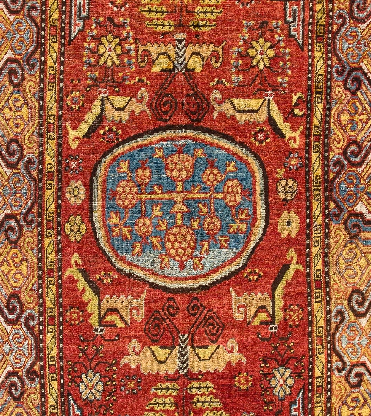 An outstanding antique Khotan rug from East Turkestan/ Western China. This is one of the best and oldest examples of woven work of art from this ancient weaving center. Well preserved condition. 
Size: 5.6 x 10.3 ft.