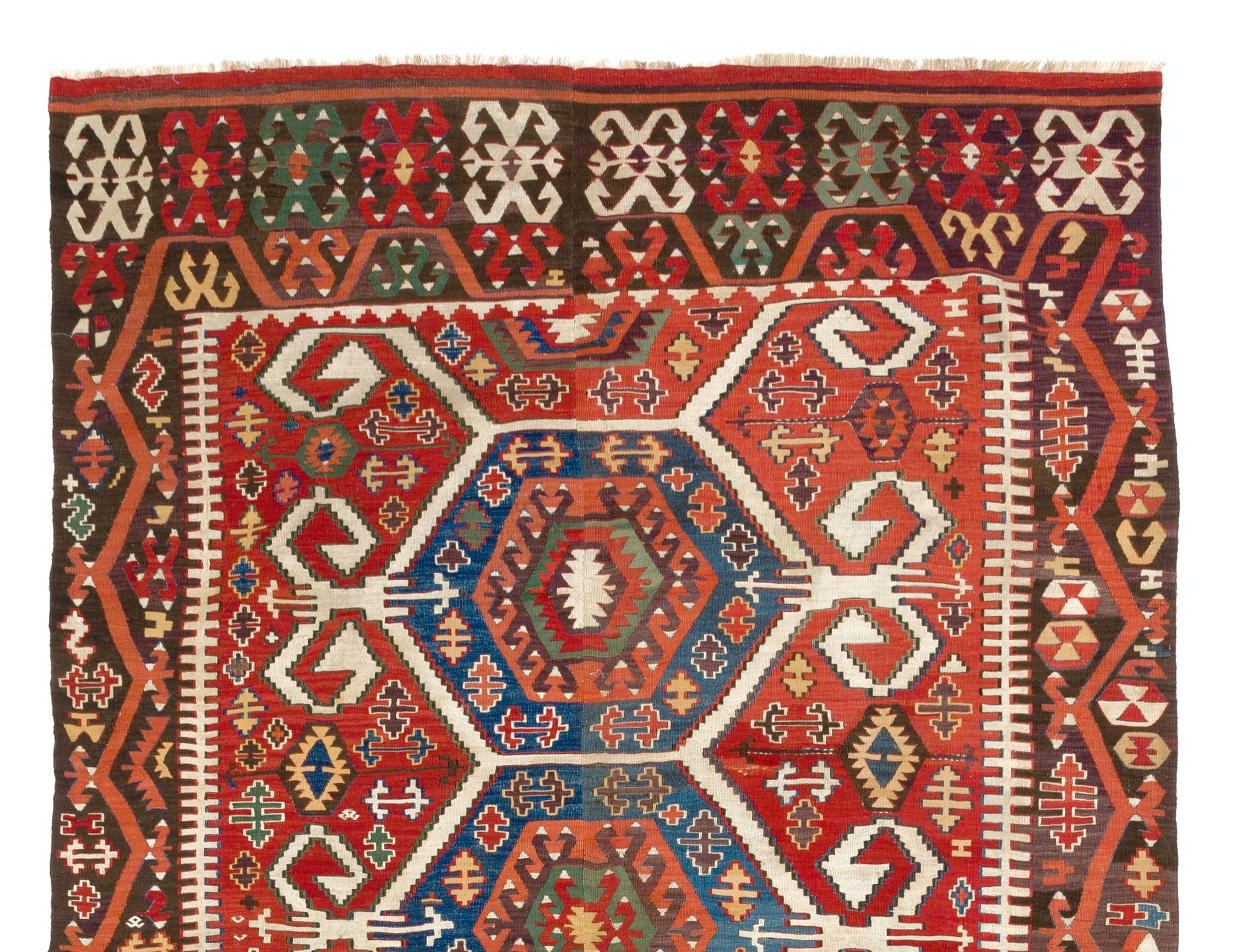 A splendid antique Kilim flat-woven rug from Central Anatolia in excellent condition. Traditionally the rug is finely handwoven in two panels and connected in the centre, it is made of wool and the colors are all sourced from natural vegetal dyes.