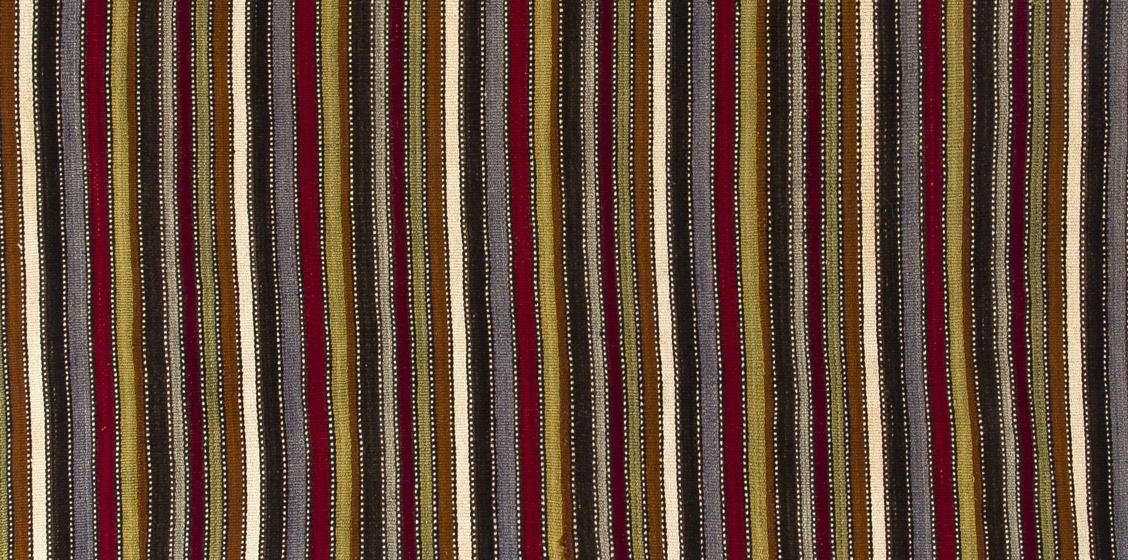 This authentic handwoven flat-weave (Kilim) from Central Turkey was made by Nomads to be used as a floor covering in their tents or summer houses around mid-20th century. Measures: 5.6 x 6 ft.

These vintage utilitarian Kilims were made to use for