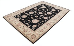 5.6x8 ft Hand Knotted Floral Area Rug with Black Field and Beige Border