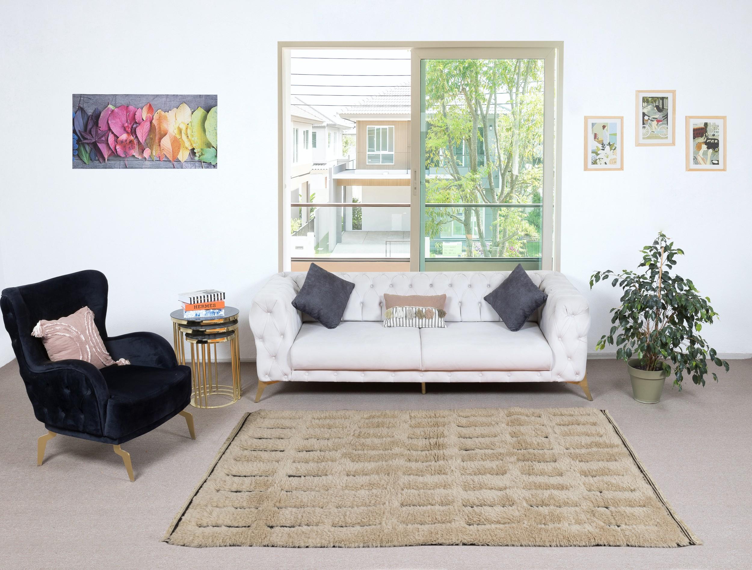 Elevate your living space with the exquisite charm of this new modern hand-knotted Moroccan berber beni ourain rug, crafted with precision and care from 100% wool. Combining the allure of Moroccan design with contemporary sensibilities, this rug is