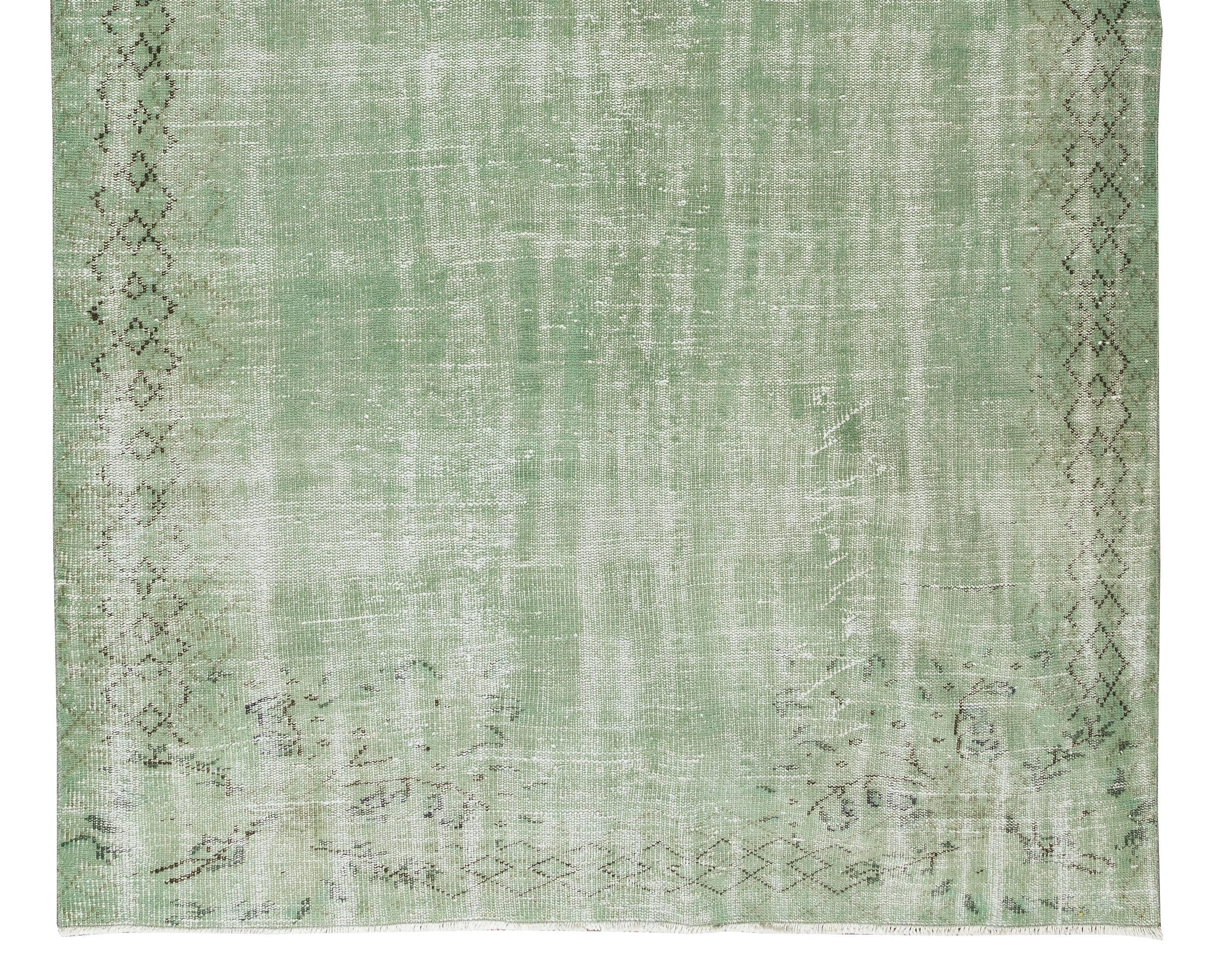 Hand-Knotted 5.6x9 Ft Handmade Central Anatolian Vintage Area Rug Over-Dyed in Light Green For Sale