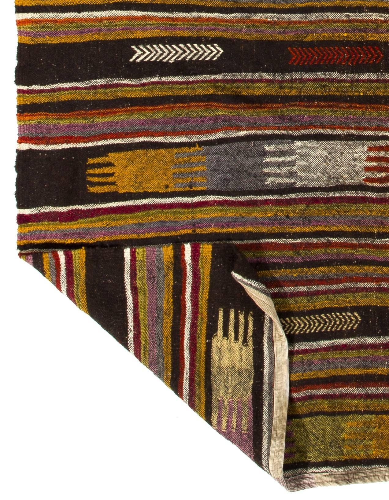 Vintage flat-weave (kilim) with striped design, 100% wool. Handwoven in Turkey in 1960s.
Washed professionally. Sturdy and suitable for both residential and commercial interiors.
Measures: 5.8 x 9 Ft
We can modify the dimensions and make it shorter