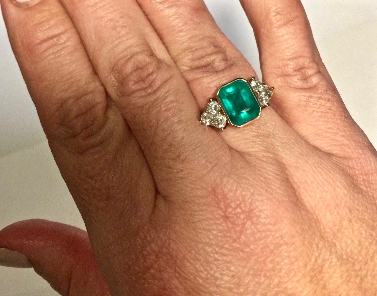 5.7 Carat Natural Colombian Emerald Diamond Engagement Ring 18K
The fine natural Colombian emerald cut weight 4.50 carats emerald cut, vivid medium green color fully saturated, very good clarity & transparency . The center emerald is adorned with