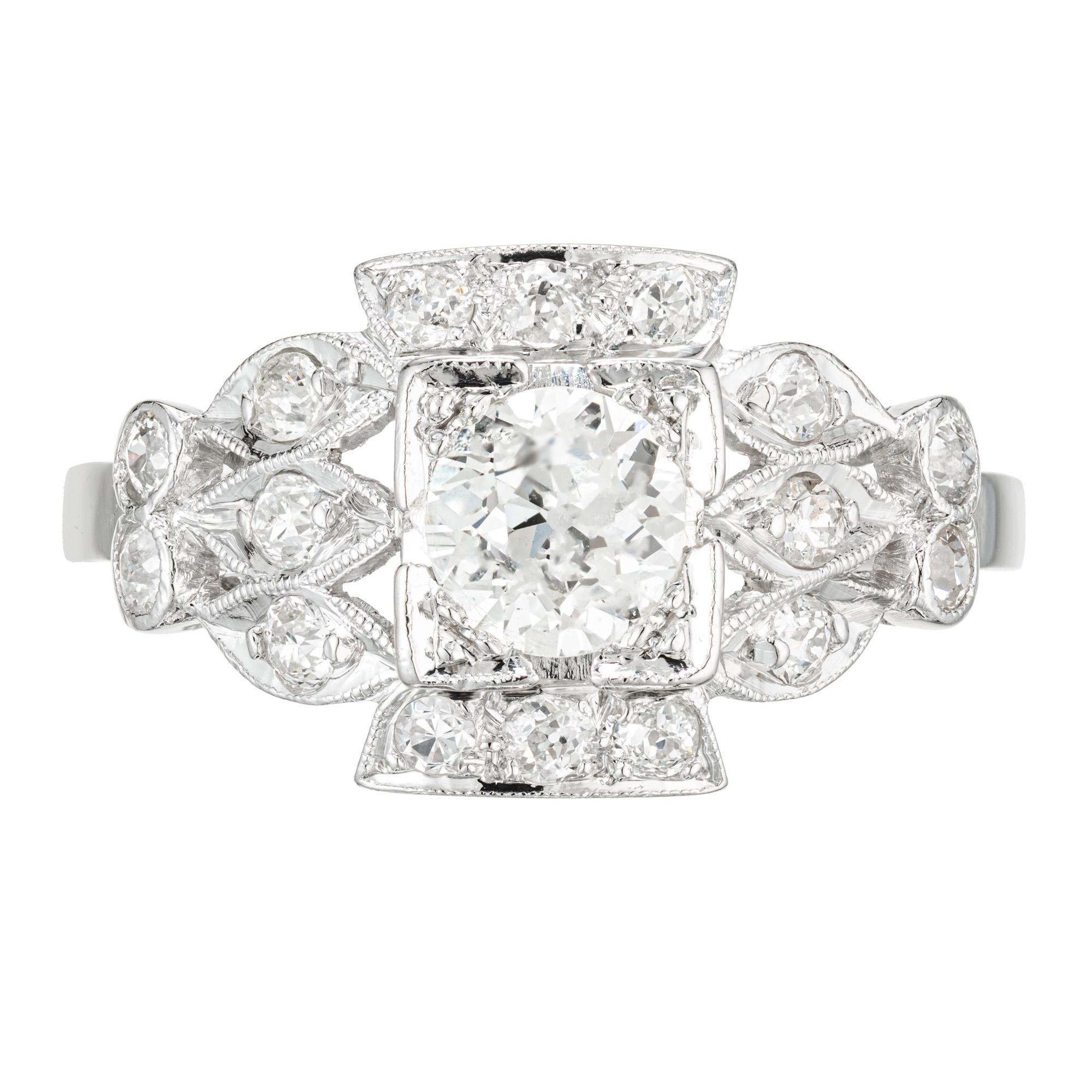 Platinum Art Deco 1920's diamond engagement ring. .57ct old European cut center diamond in a platinum setting with 16 old European cut diamonds. 

1 old European cut diamond, approx. total weight .57cts, H – I, VS1, 
16 old European cut diamonds,