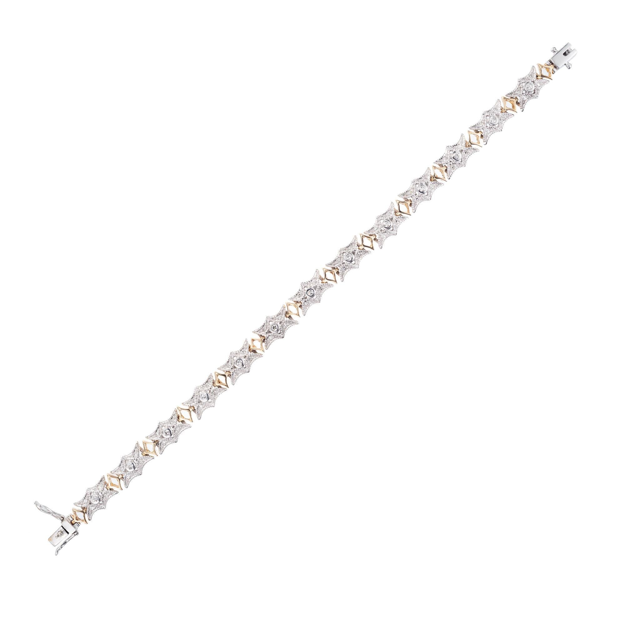 14k white and yellow gold link bracelet. Gold stretched star designs contain a center bezel set Diamond with four bead set Diamonds above and below the bezel. Yellow gold open Diamond shape link connects each white gold link. 7 inches. 

13 round
