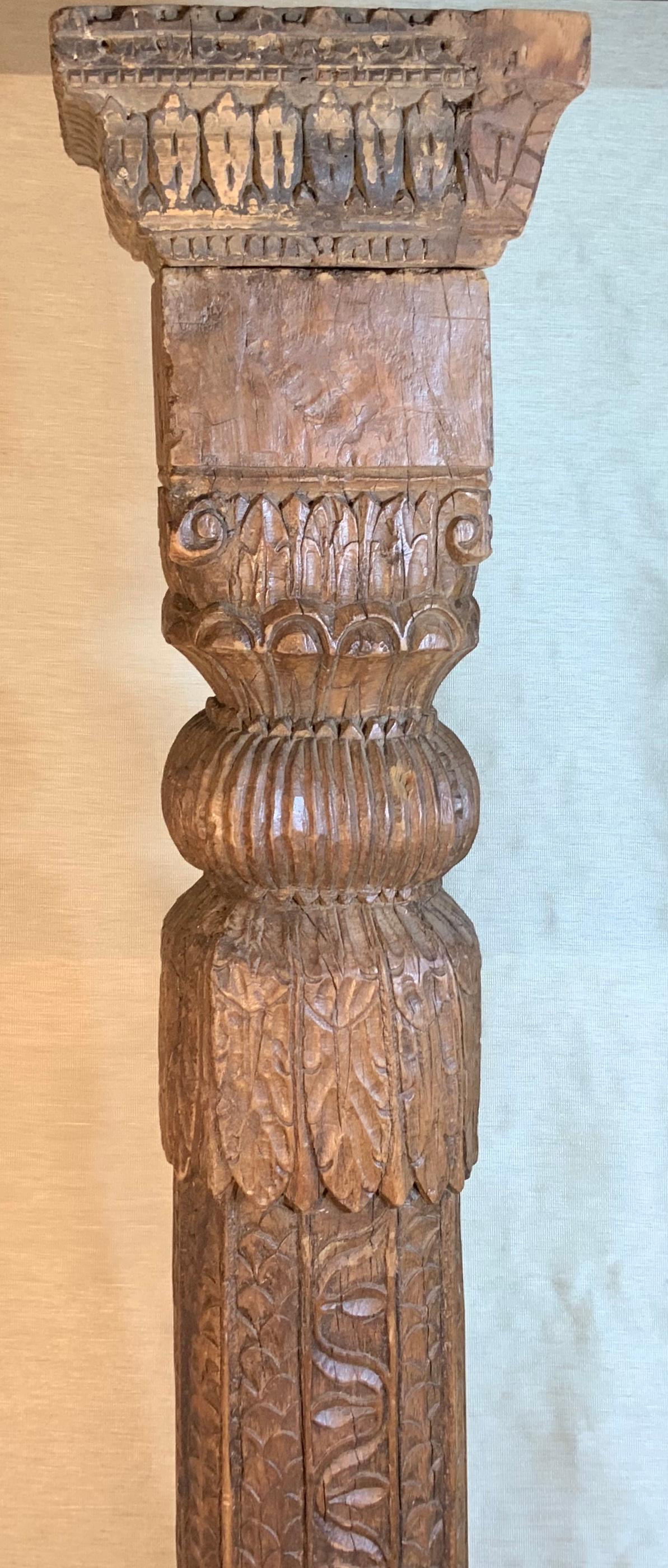 Highly carved solid teak wood column that was made for indoor use in opulent homes in India. This column stood the test of time and was made by hand picked artisans. Great decorative object of art for display / or even converting it to a floor lamp