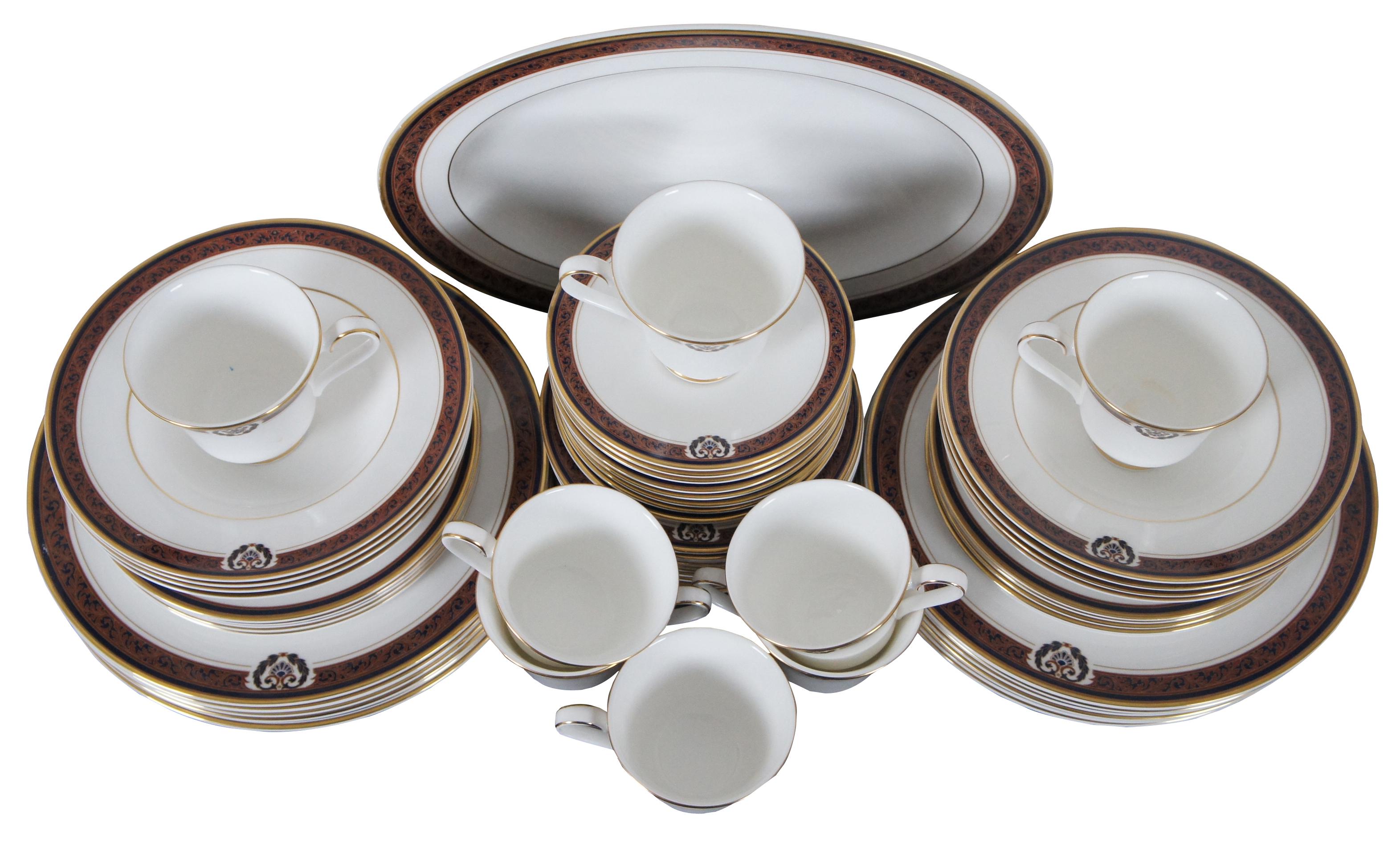 57 piece Royal Doulton fine bone china dinnerware set in pattern H5221 – Regal Crest.

Measures: 8 teacups - 3.5” x 3” / oval platter - 13.5” x 10.5” x 1.25” / 12 dinner plates - 10.5” x 0.75” / 8 soup bowls - 8” x 1.5” / 10 salad plates - 8” x