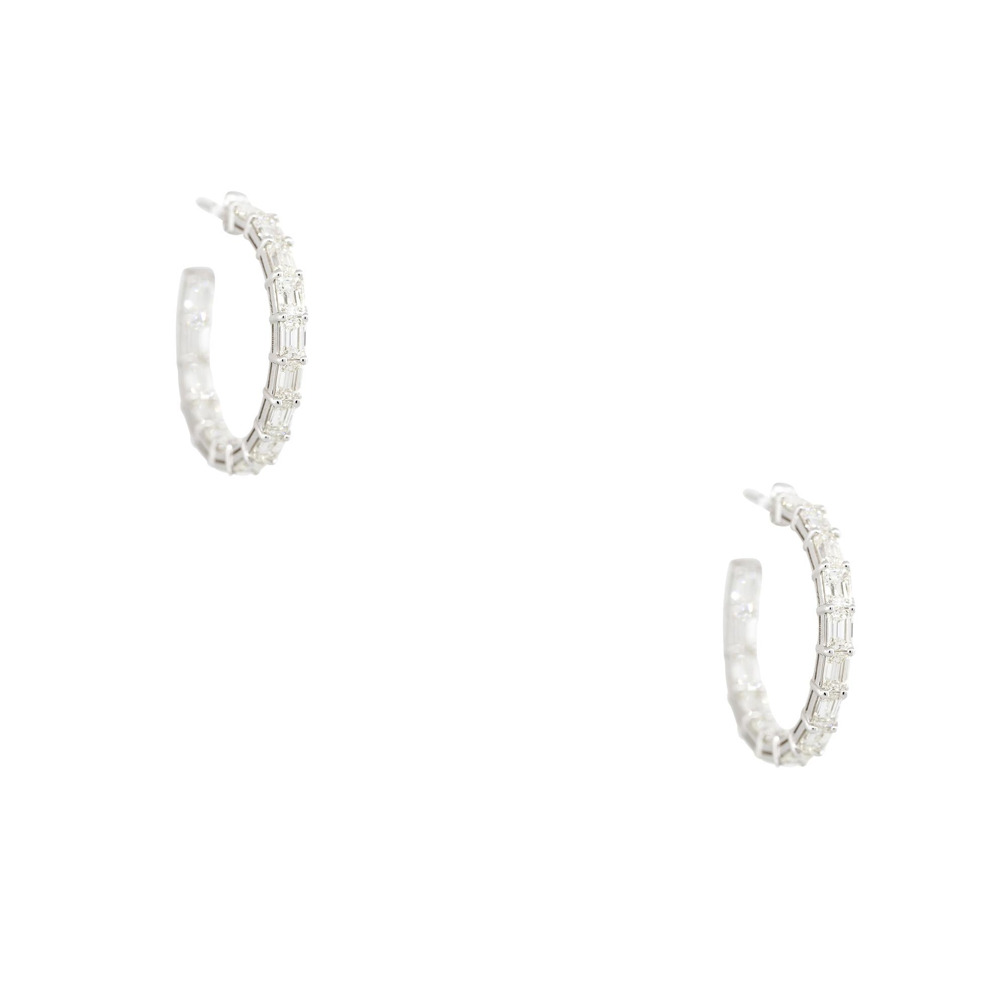 18k White Gold 5.70ctw Emerald Cut Diamond Hoop Earrings
Material: 18k White Gold
Diamond Details: Approximately 5.70ctw of Emerald cut Diamonds. Diamonds are set inside out on the hoop earrings. Diamonds are approximately H/I in color and
