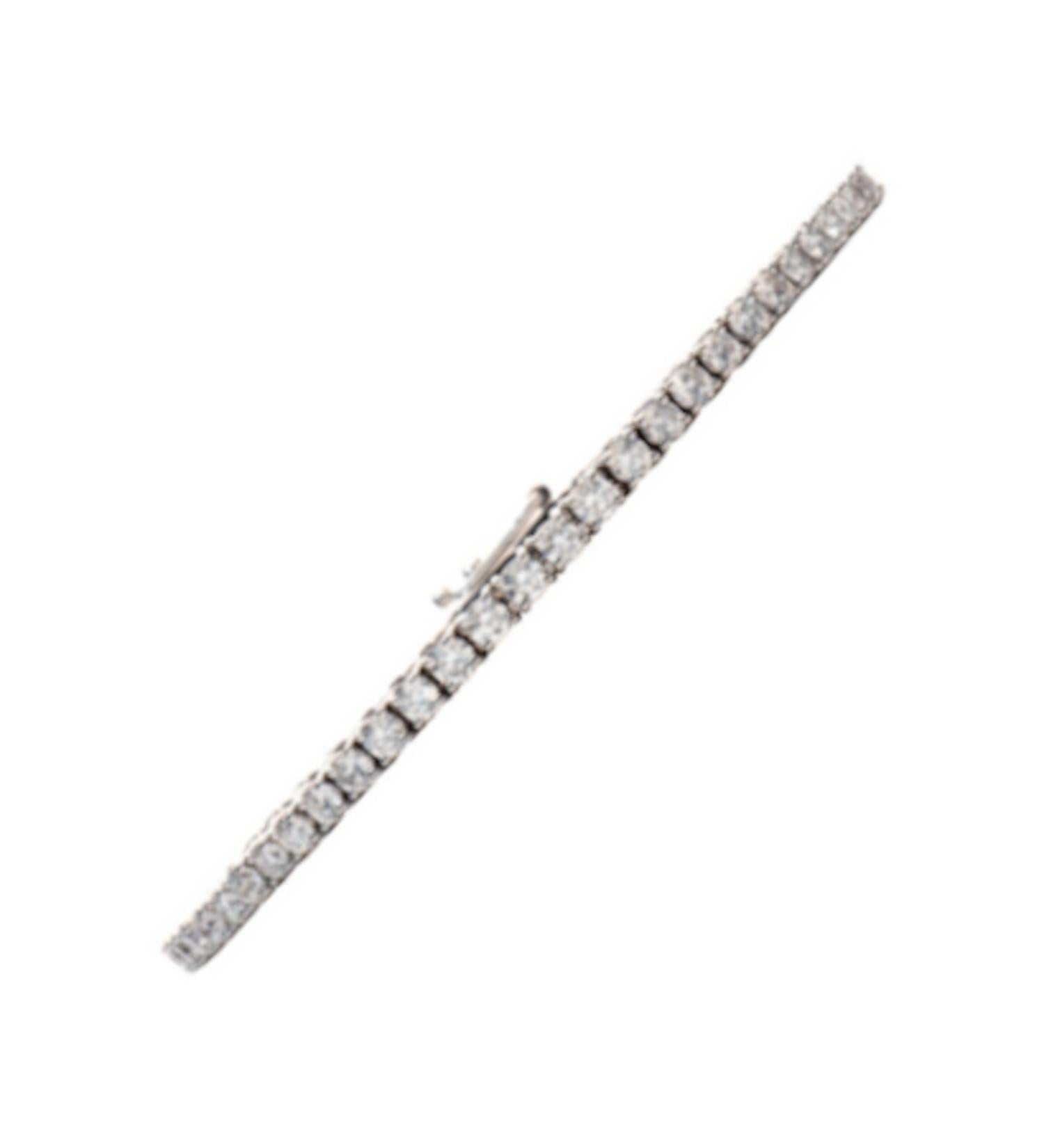 Introducing our exquisite tennis bracelet, meticulously crafted in Italy, adorned with the finest details that exemplify unparalleled craftsmanship. This stunning piece is crafted in 18k white gold, radiating a timeless elegance.

The bracelet