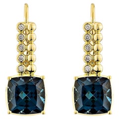 5.70 Carat London Blue Topaz Drop Earring in 18KYG With White Diamond.