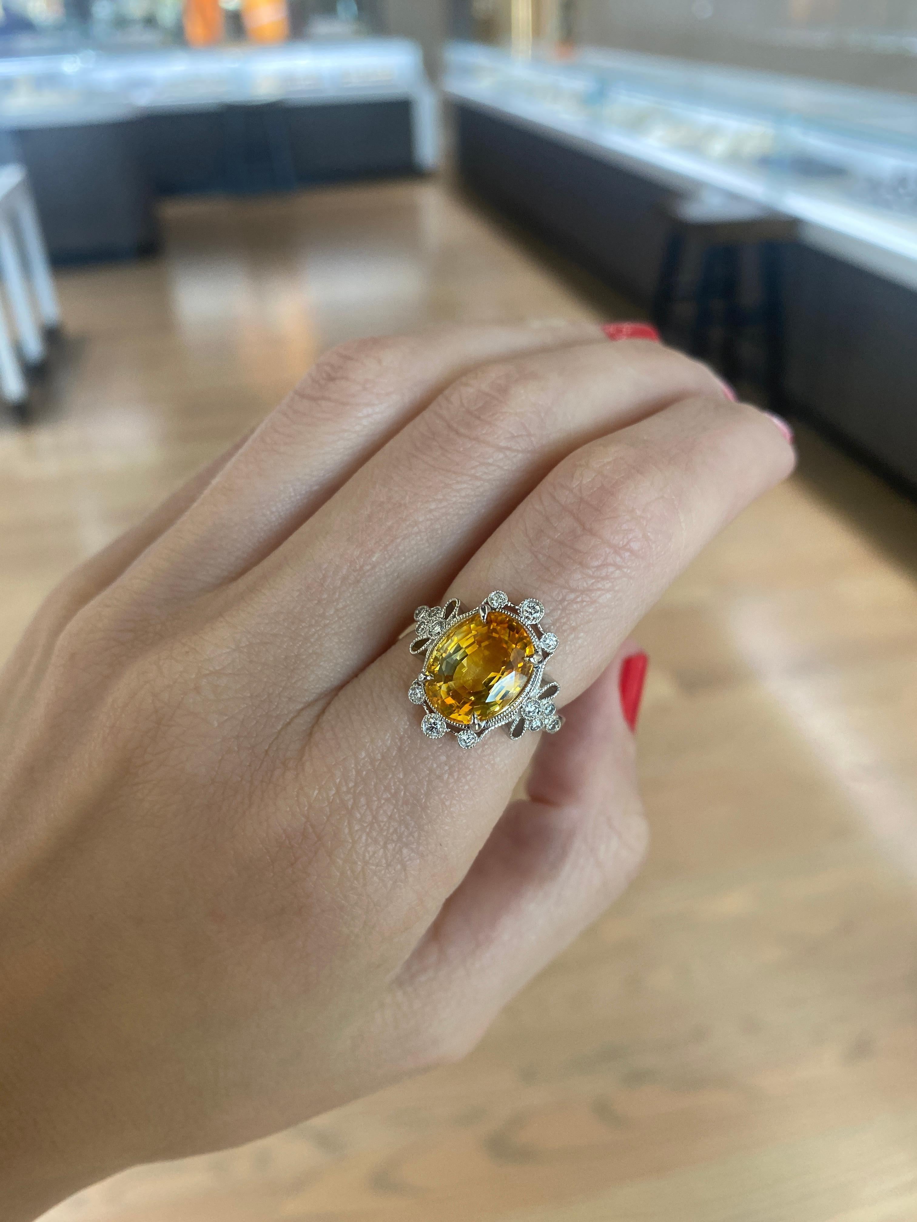 5.70 Carat Orange-Yellow Oval Cut Sapphire w/ 0.20ctw Diamond Accent Ring For Sale 7