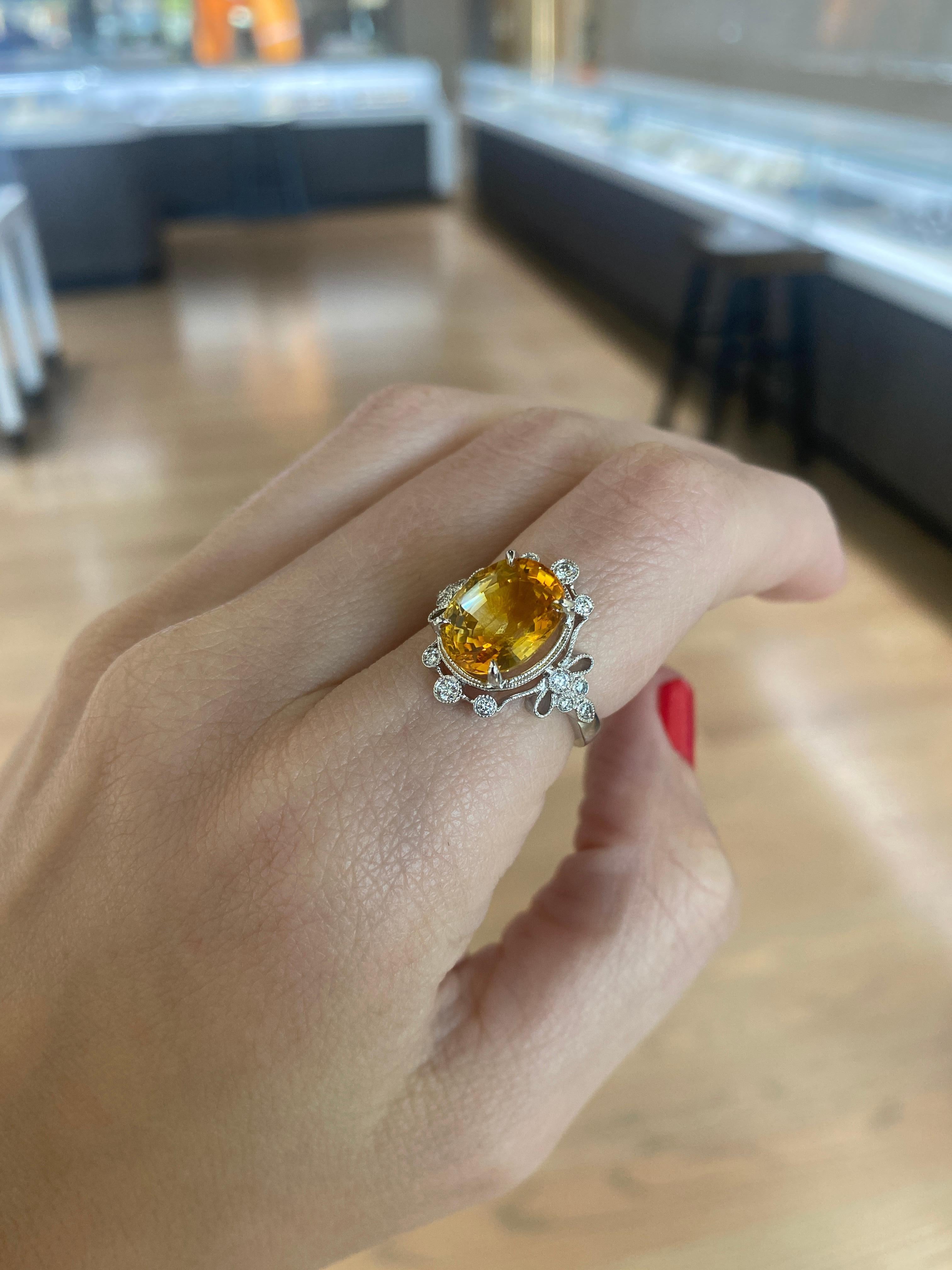 5.70 Carat Orange-Yellow Oval Cut Sapphire w/ 0.20ctw Diamond Accent Ring For Sale 2