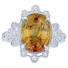 5.70 Carat Orange-Yellow Oval Cut Sapphire w/ 0.20ctw Diamond Accent Ring
