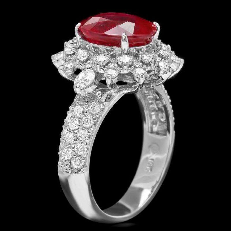 5.70 Carats Impressive Natural Red Ruby and Diamond 14K White Gold Ring

Total Red Ruby Weight is: Approx. 4.40 Carats 

Ruby Measures: Approx. 11.00 x 8.00mm

Ruby treatment: Fracture Filling

Natural Round Diamonds Weight: Approx. 1.30 Carats