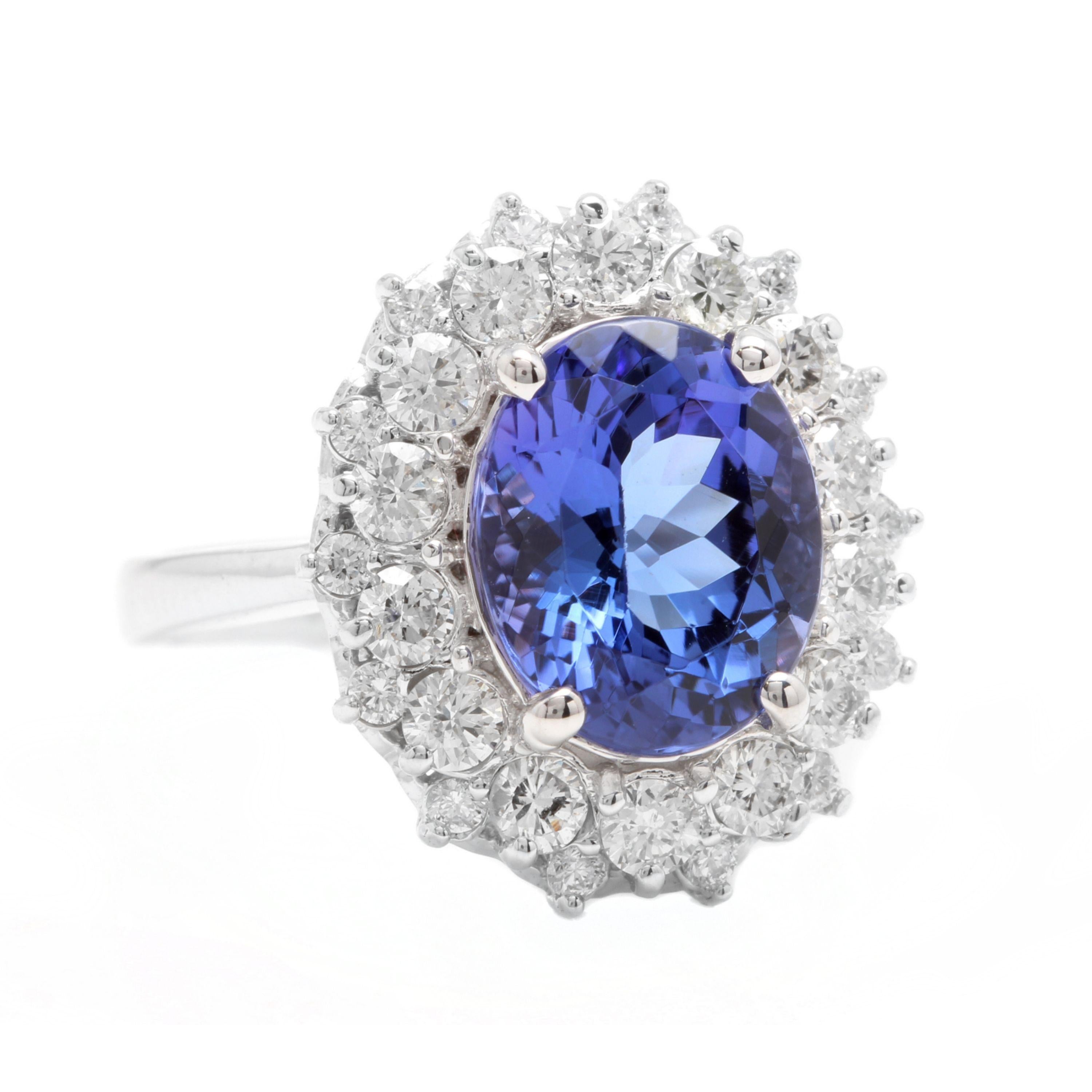 5.70 Carats Natural Very Nice Looking Tanzanite and Diamond 14K Solid White Gold Ring

Total Natural Oval Cut Tanzanite Weight is: Approx. 4.40 Carats

Tanzanite Measures: 11.00 x 9.00mm

Natural Round Diamonds Weight: Approx. 1.30 Carats (color G-H