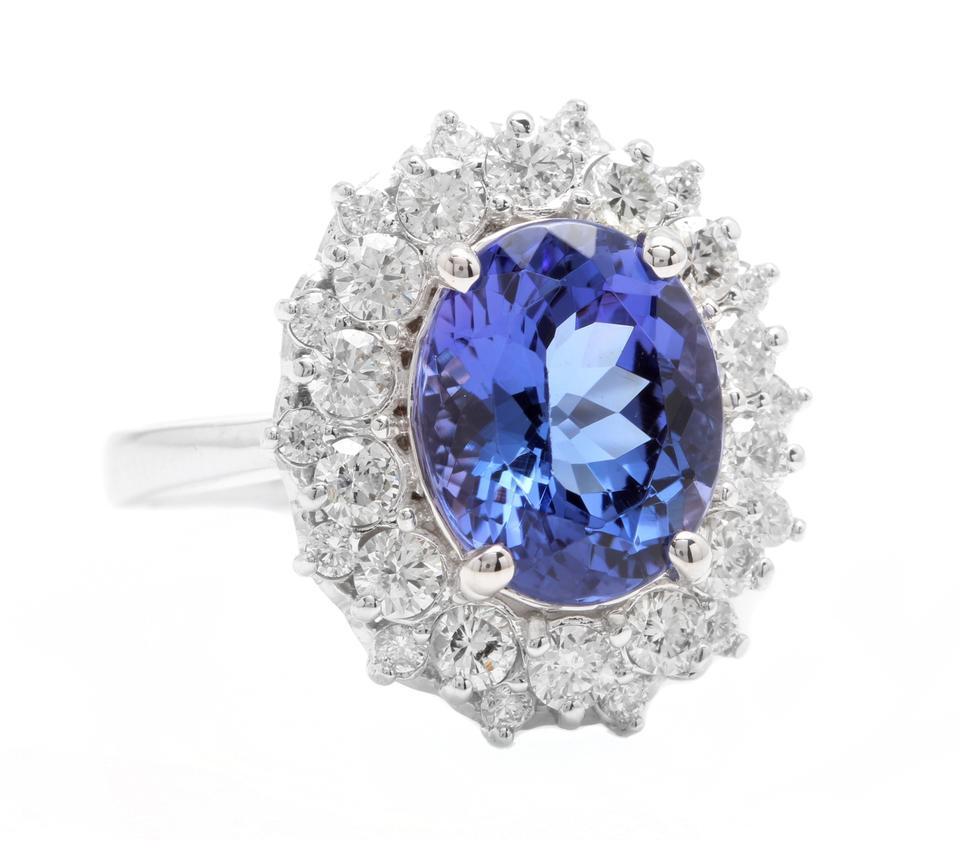 5.70 Carats Natural Very Nice Looking Tanzanite and Diamond 14K Solid White Gold Ring

Total Natural Oval Cut Tanzanite Weight is: Approx. 4.40 Carats

Tanzanite Measures: 11.00 x 9.00mm

Natural Round Diamonds Weight: Approx. 1.30 Carats (color G-H