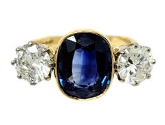 5.70 Carats Total Cushion Cut Natural Blue Sapphire and Diamond Three Stone Ring