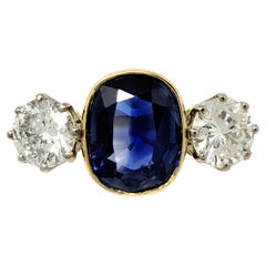 Vintage 5.70 Carats Total Cushion Cut Natural Blue Sapphire and Diamond Three Stone Ring