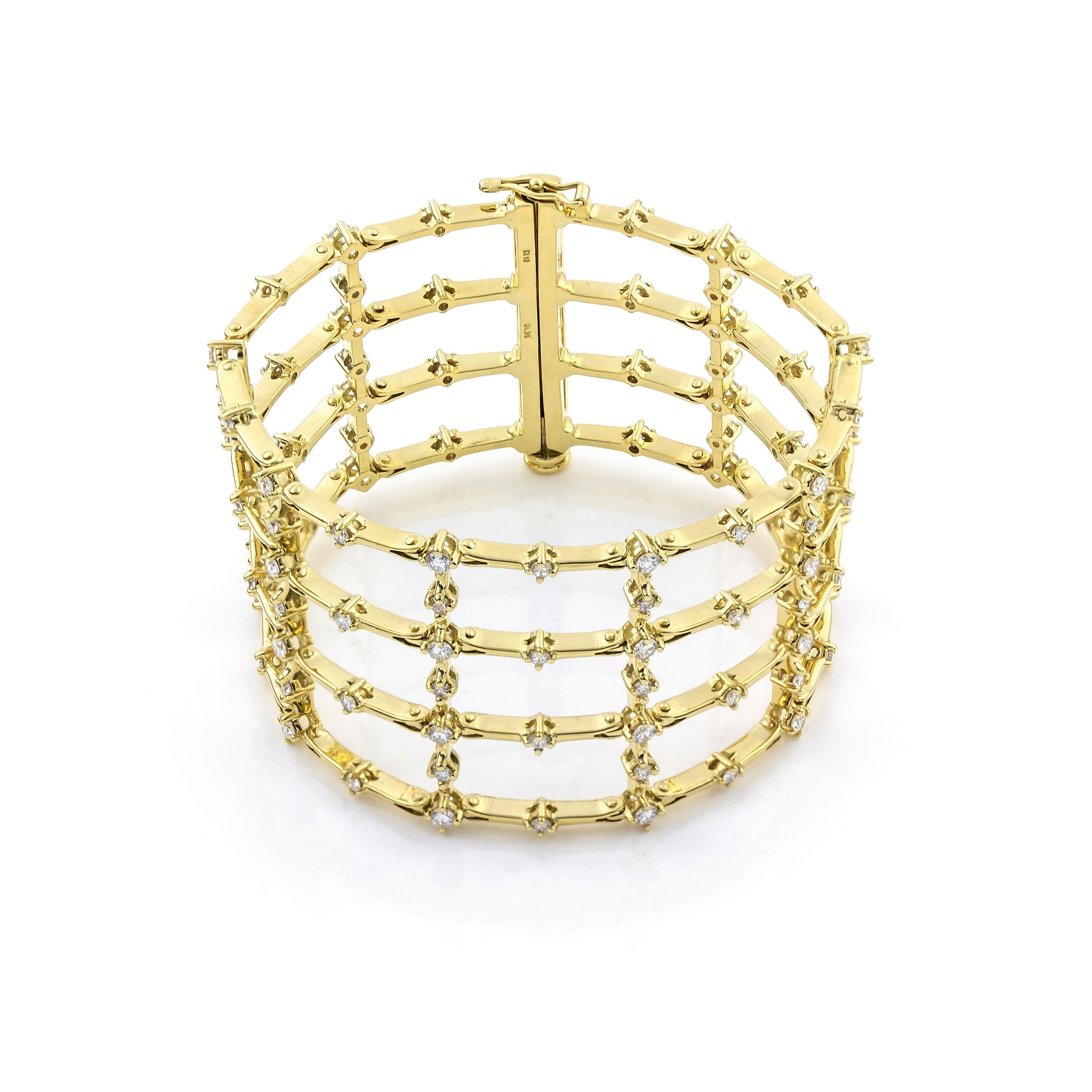 Big Cuff Bracelet in 18Kt Yellow Gold with  Prong Setting brilliant cut diamonds 5.70 carats, Fence shape 
Cage Cuff bracelet inspired by the garden fence. This unique piece is made of 18Kt yellow gold and brilliant cut diamonds 5.70 ct on its