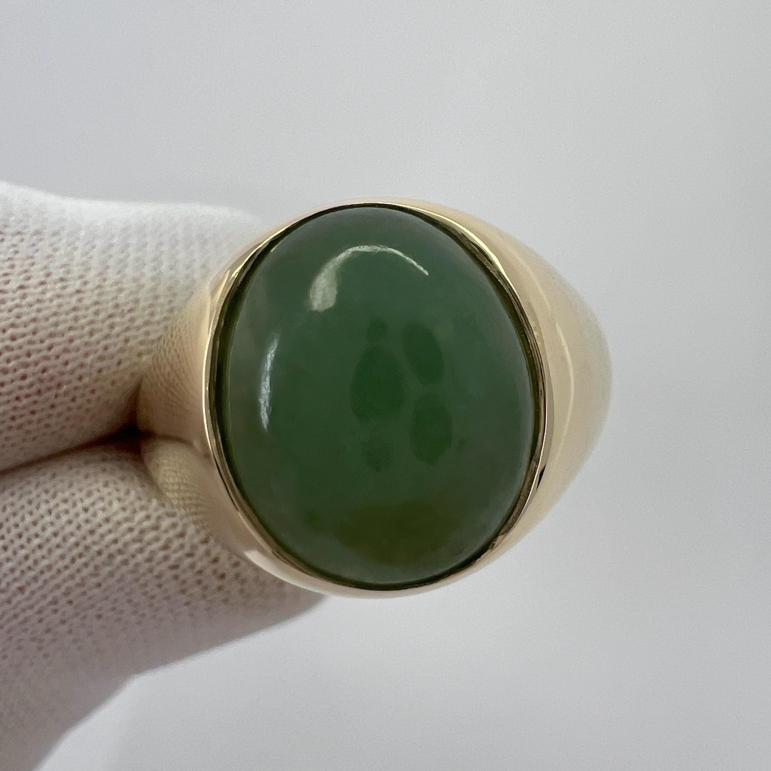 GIA Certified A-Grade Deep Green Jadeite 9k Yellow Gold Oval Signet Ring.

A stunning 5.70 carat untreated green jadeite jade set in a fine 9k yellow gold rubover bezel signet ring.

This jade has an excellent oval cabochon cut showing the colour
