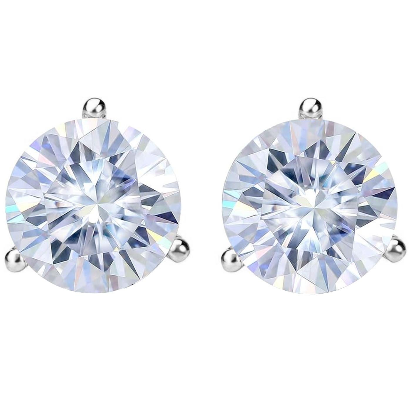 These stunning earrings showcase two GIA-certified natural diamonds, meticulously matched and expertly set in classic three-prong martini settings, designed to maximize brilliance and elegance. These earrings represent timeless luxury, with