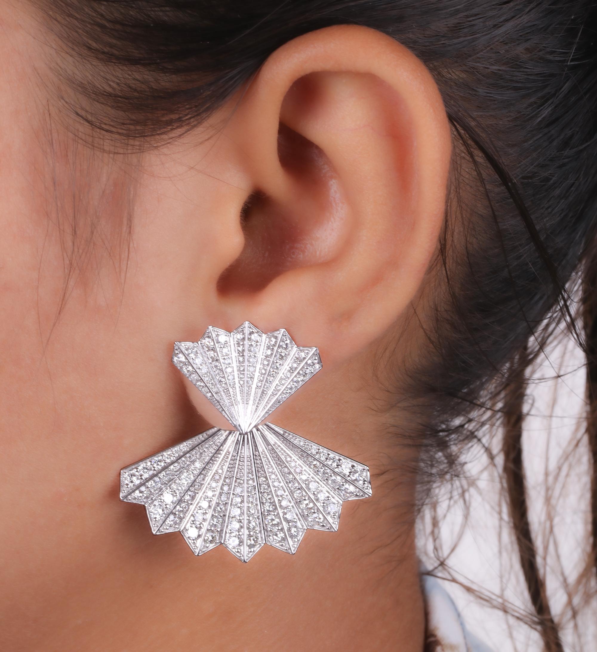 These 5.71 Carat Diamond Pave Jacket Fan 18 Karat White Gold Earrings features two diamond set fan shapes , one small and one big. Smaller one pointing up while the bigger one pointing down.
Diamonds are a universal symbol of eternity and strength.
