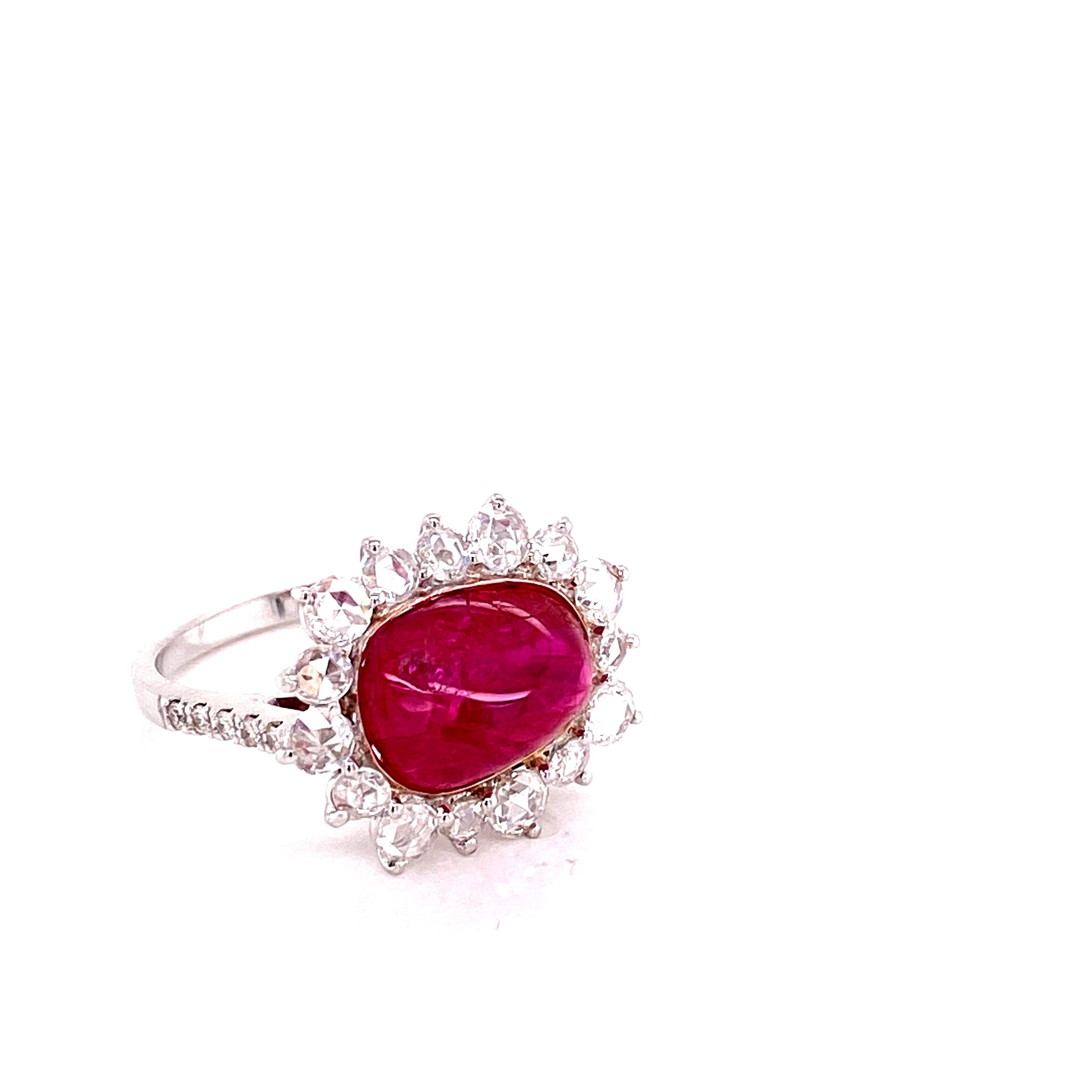 5.71 Carat GRS Certified Unheated Burmese Ruby and White Diamond Engagement Ring:

A beautiful and rare jewel, it features a gorgeous GRS certified unheated Burmese ruby cabochon weighing 5.71 carat, surrounded by white rose-cut diamonds weighing