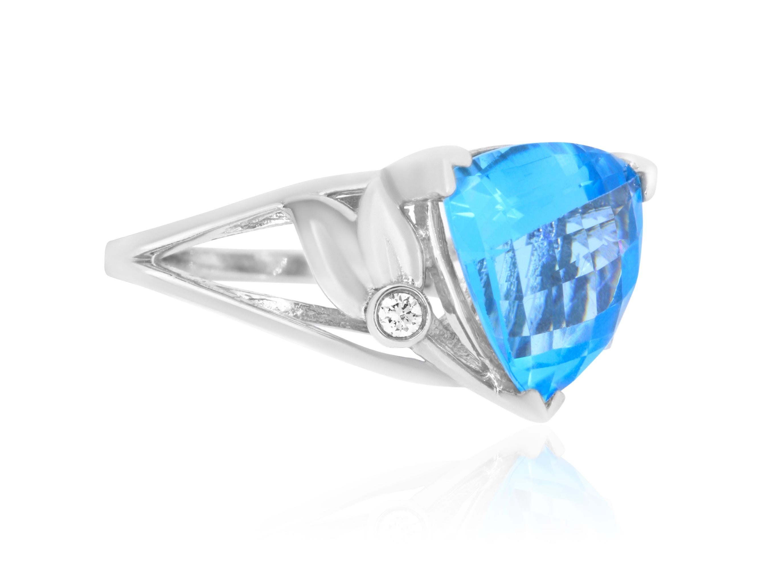 This beautiful trillion cut blue topaz sits in 14K White Gold with simple and classic diamond detail.

Material: 14k White Gold 
Center Stone Details: 5.71 Carat Trillion Cut Blue Topaz
Diamond Details: 2 Brilliant White Diamonds at 0.06 Carats - SI