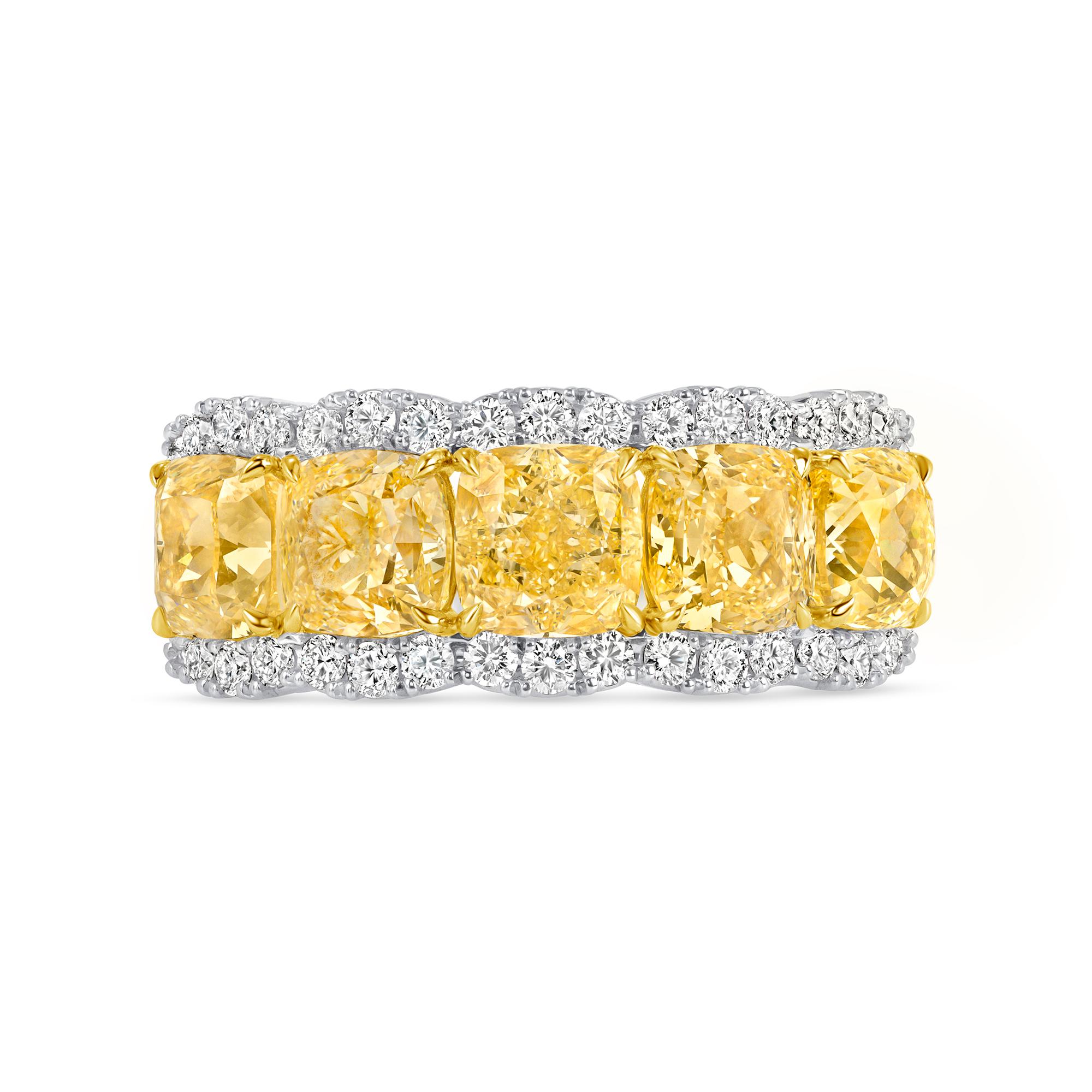 Light Fancy Yellow Diamond Five Stone Ring with Diamond Halo in 18K Gold and Platinum. This ring has five Light Fancy Yellow cushion shape diamonds and thirty-eight round diamonds, weighing an approximately 5.71 carats in total.