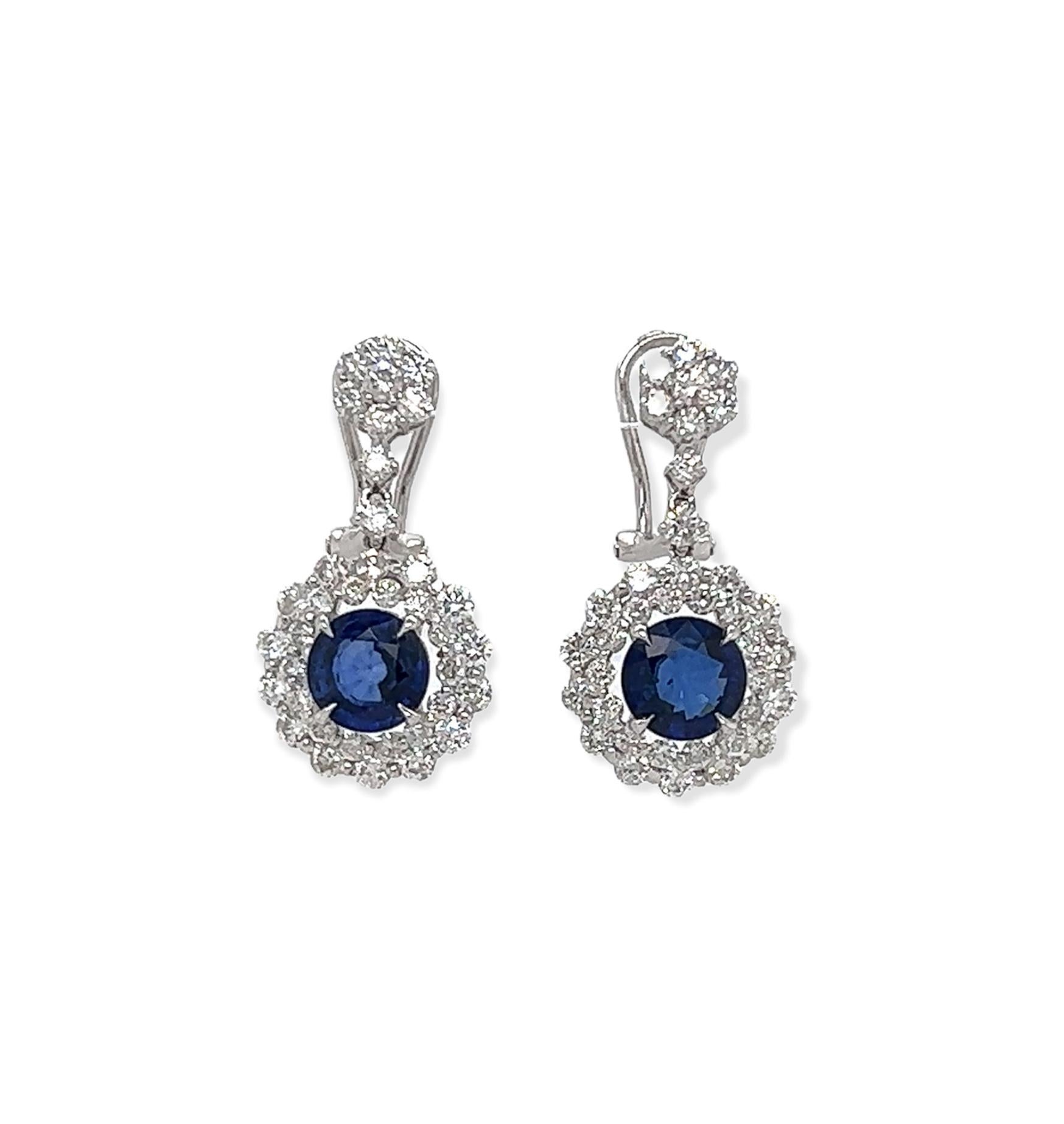 5.71 Total Carat Blue Sapphire Drop Earrings with Bezel set Double-Halo Diamond in 18K White Gold

These glamorous sapphire earrings are perfectly handcrafted from the finest diamonds, sapphire, and white gold. The aesthetics of blue sapphires