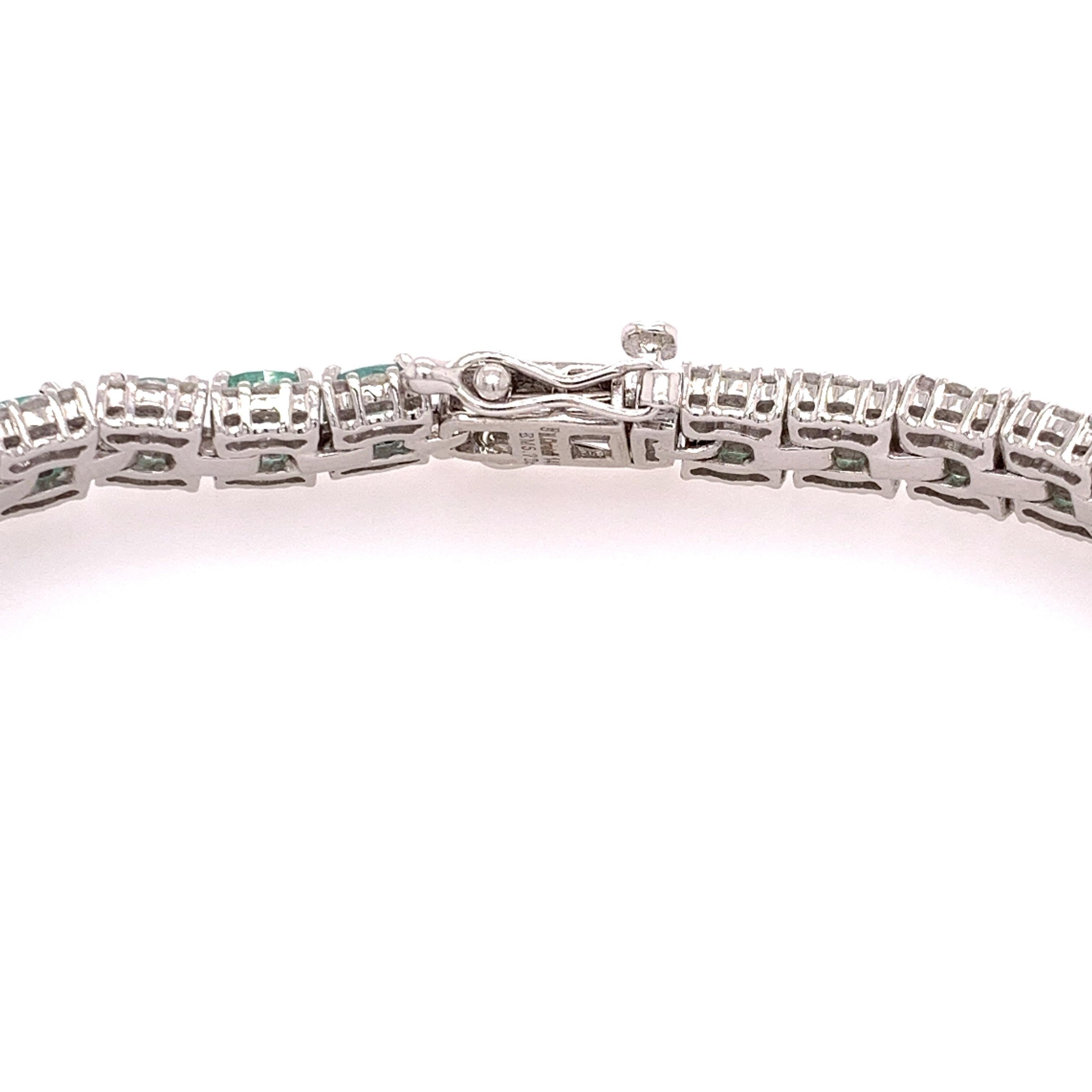 Elegant emerald diamond tennis bracelet. Lively medium green colour with lustre, oval faceted, 5.72 carats natural emerald mounted in an open basket with four bead prongs, accented with two rows of round brilliant cut diamonds. Handcrafted flexible