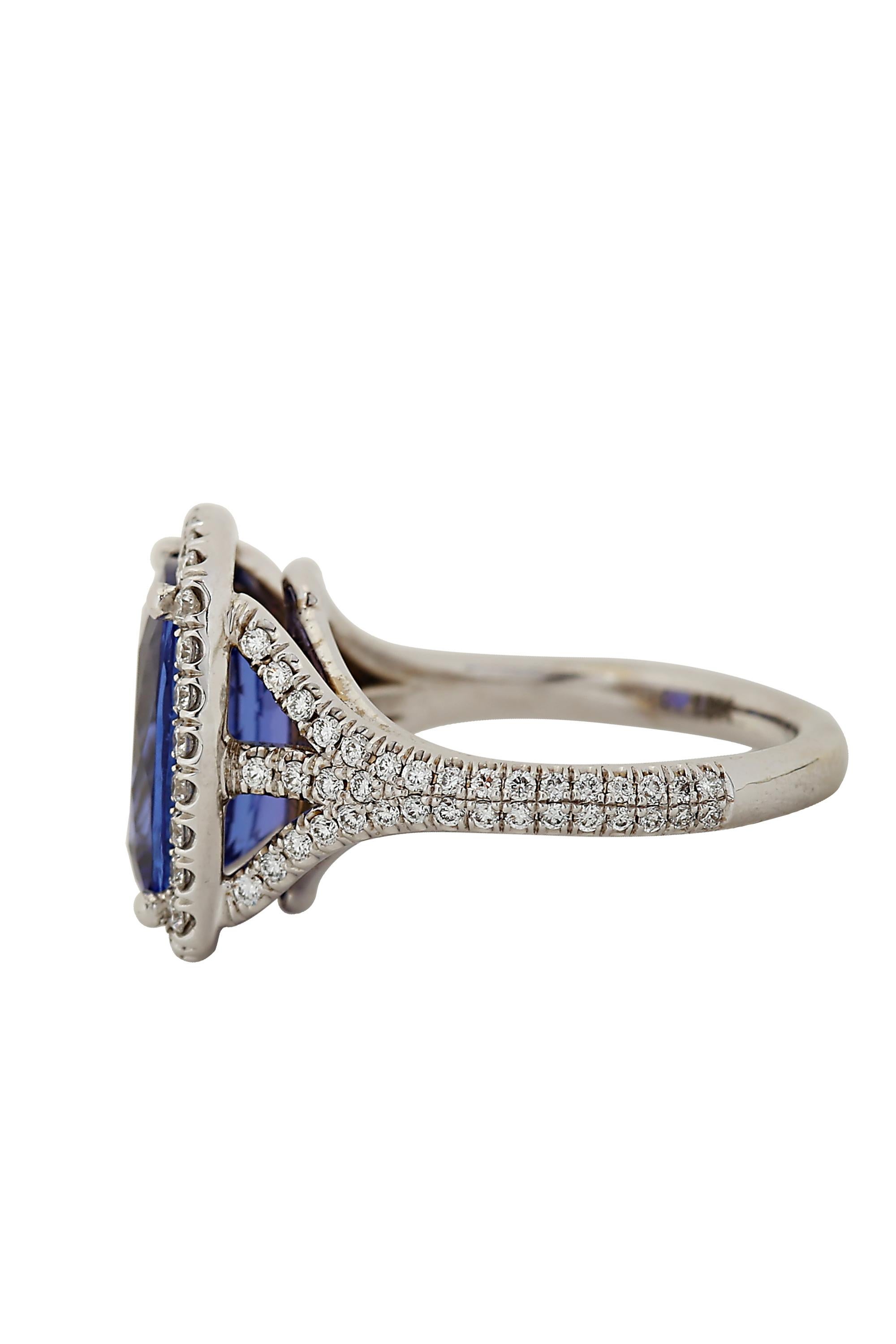 This stunning and vibrant contemporary ring features a rich, jewel toned violet
tanzanite highlighted by an exceptional 18 karat white gold and micro pavé
setting. The center Tanzanite weighs 5.72 carats and the mounting is set with 2 carats of